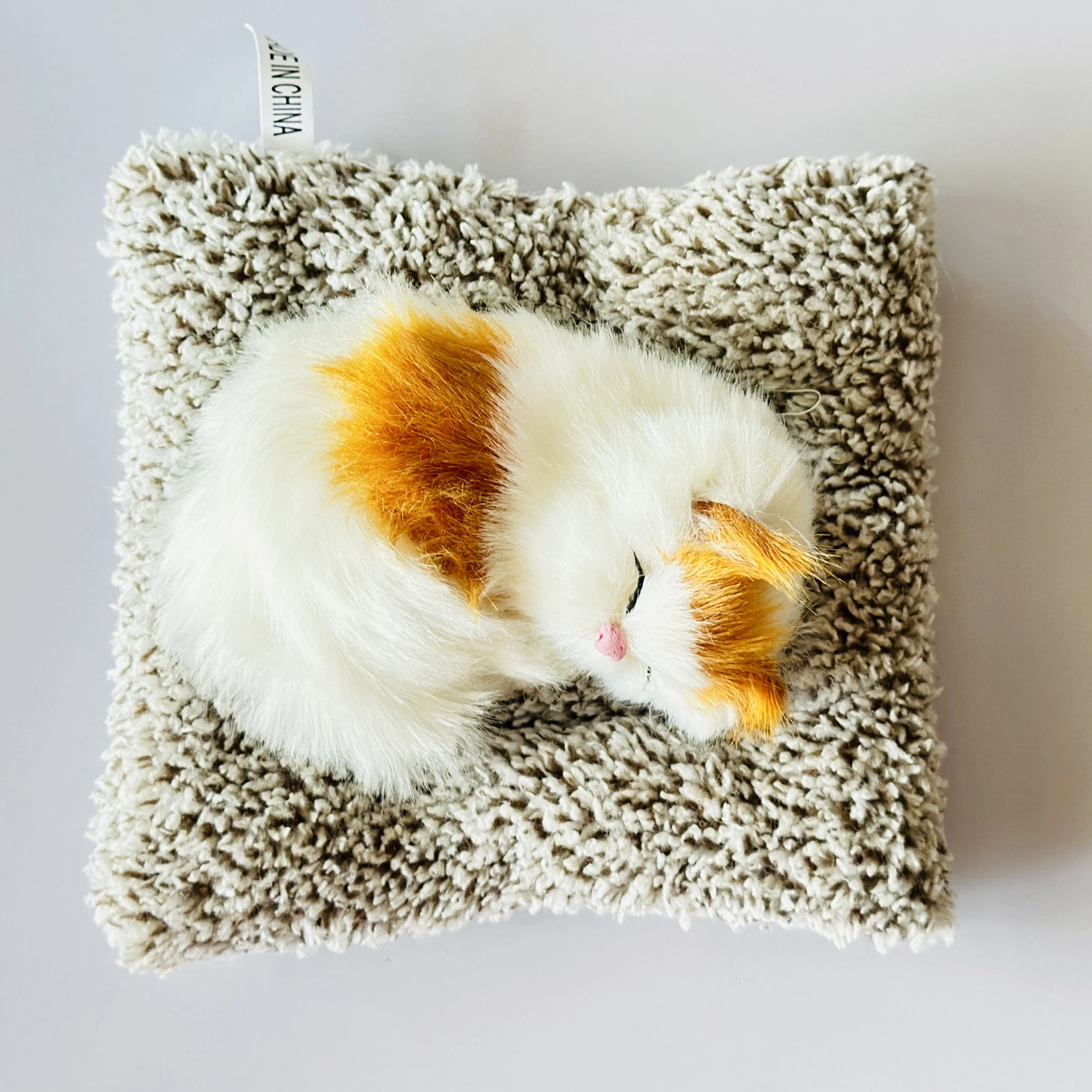Realistic sleeping cat plush toy