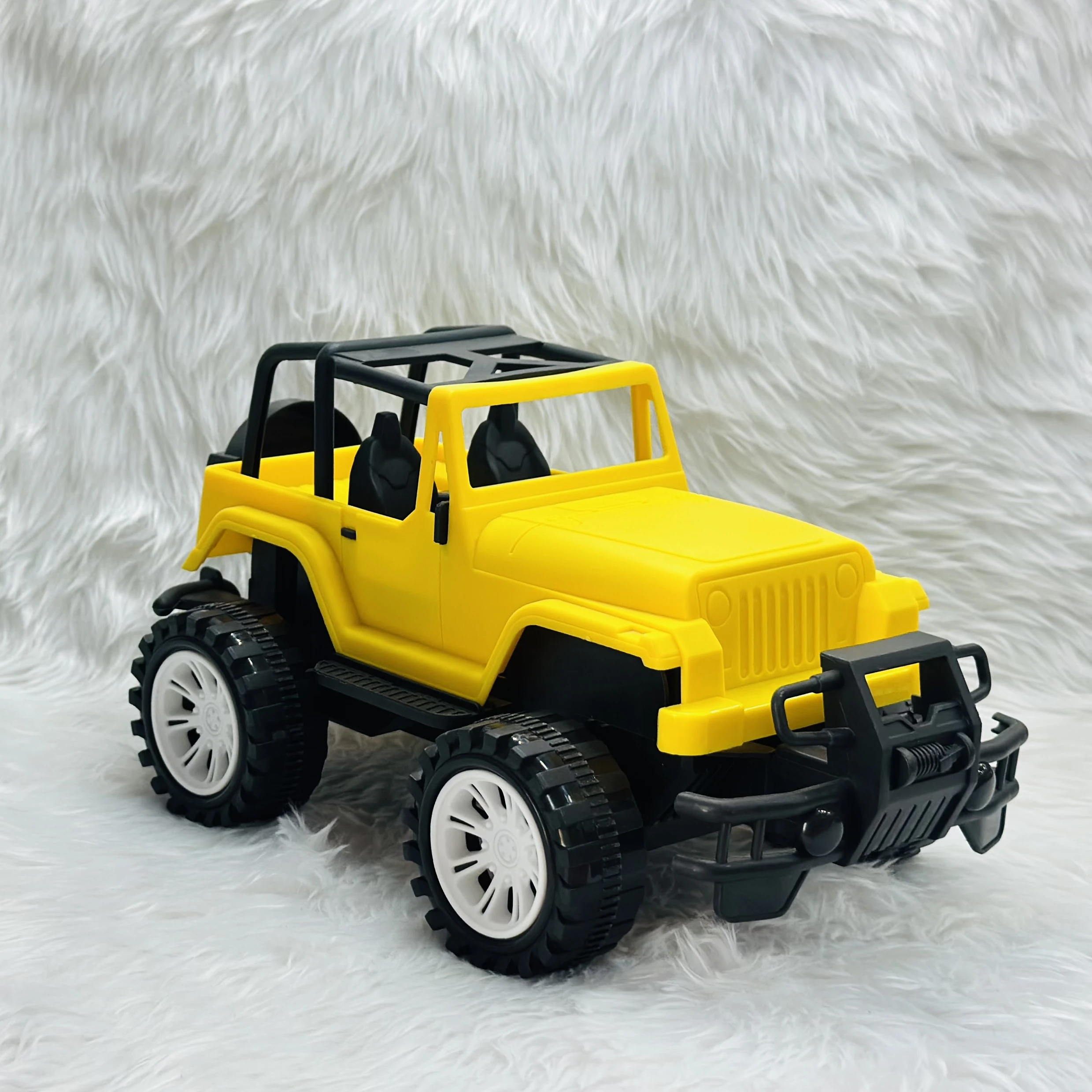 Yellow plastic toy jeep