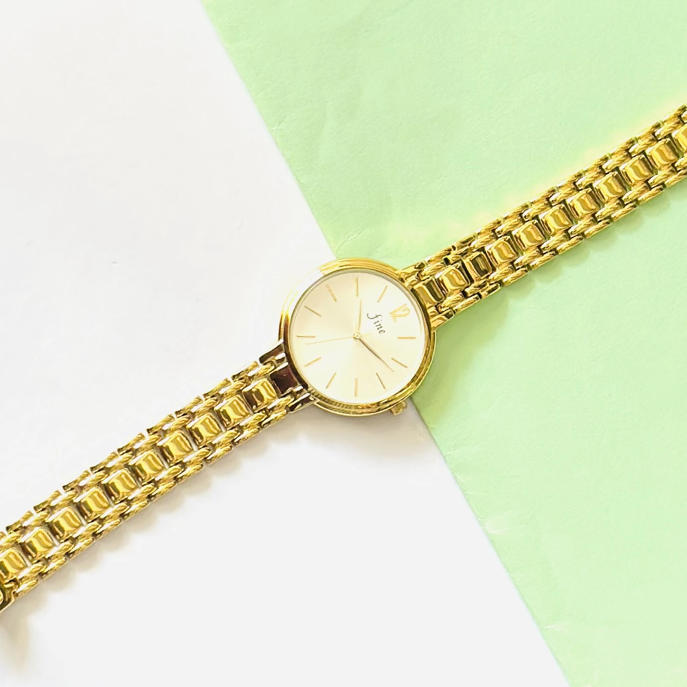 Gold tone women's analog watch