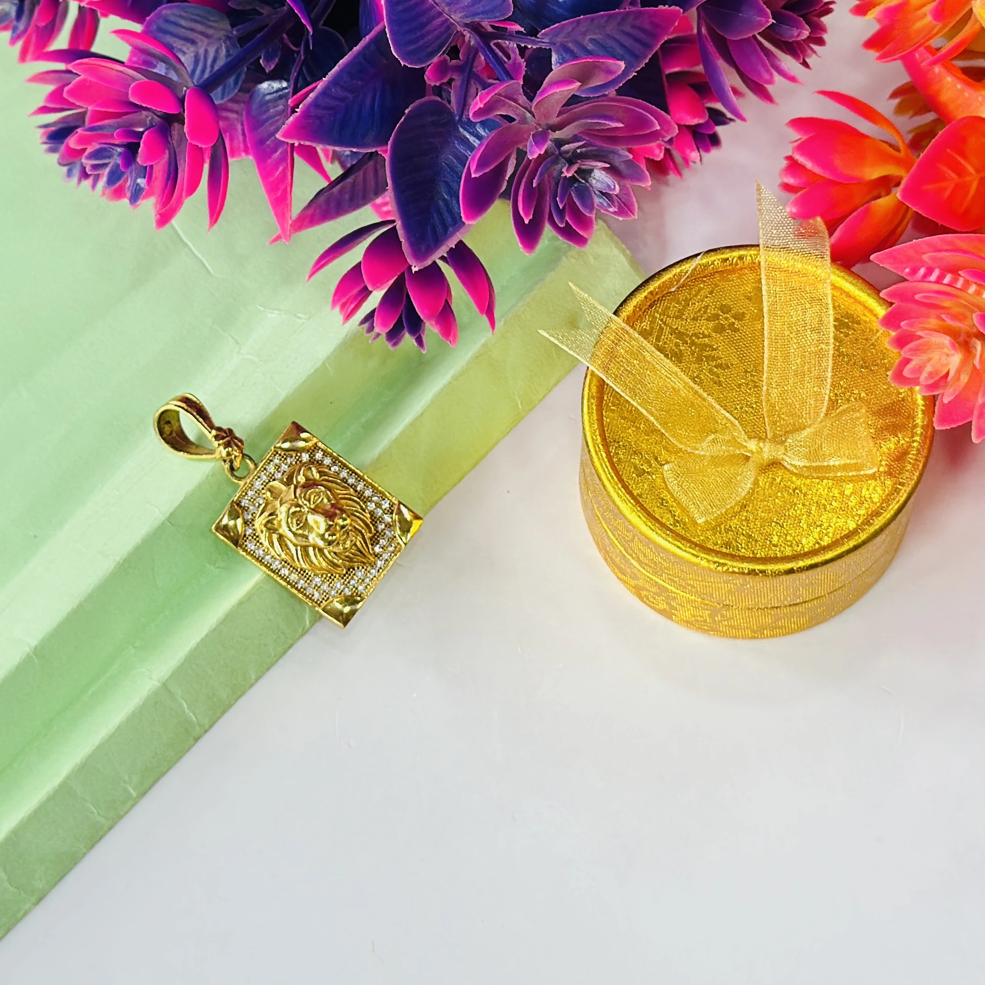 Gold plated lion face pendant