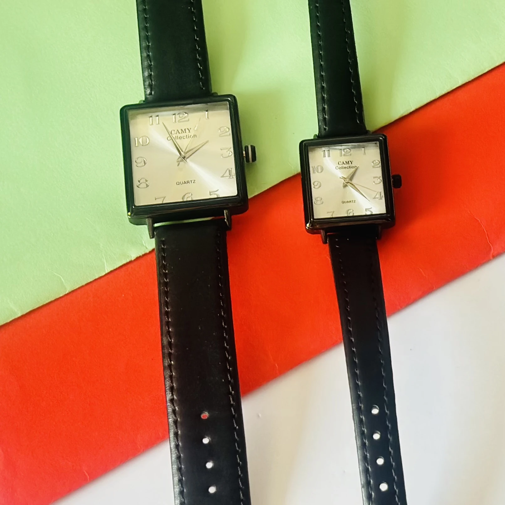 Camy Collection analog quartz watches with black leather straps and square dials.