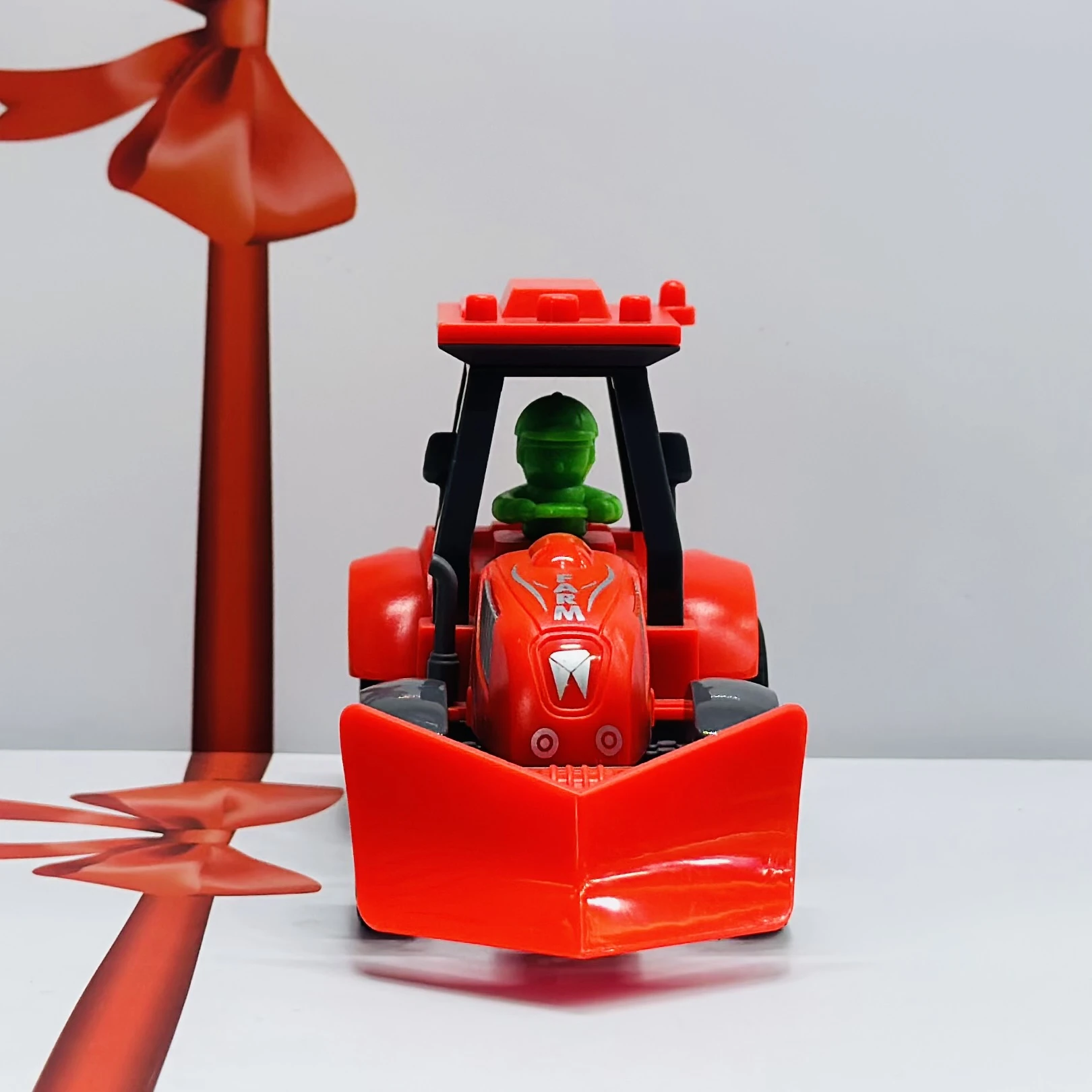Red plastic toy tractor
