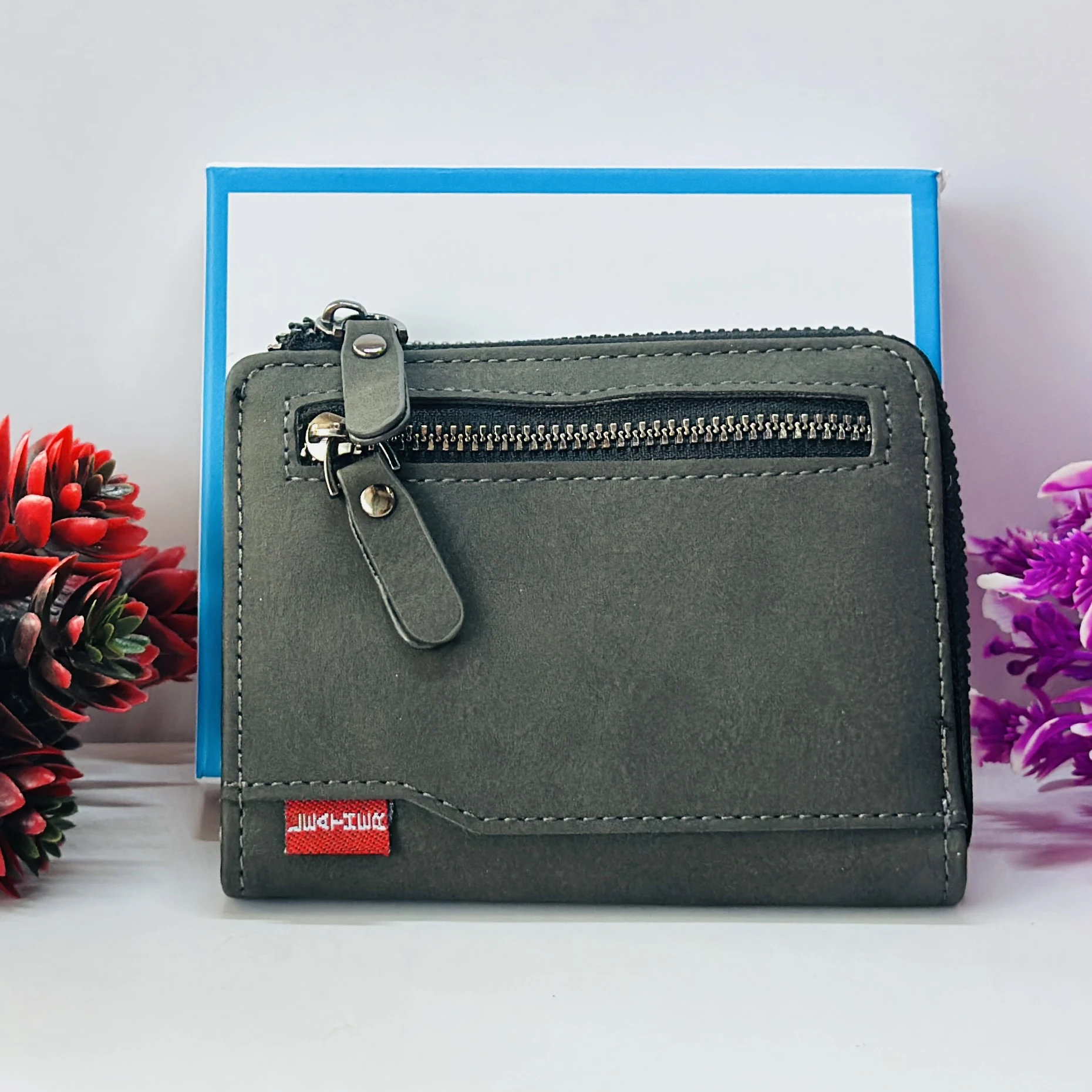 compact men's wallet with a secure zip closure, made from vegan leather.