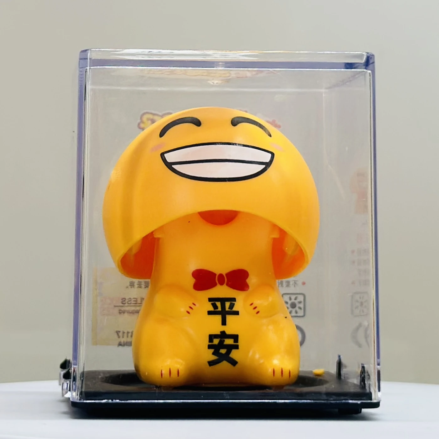 solar-powered smiley figurine