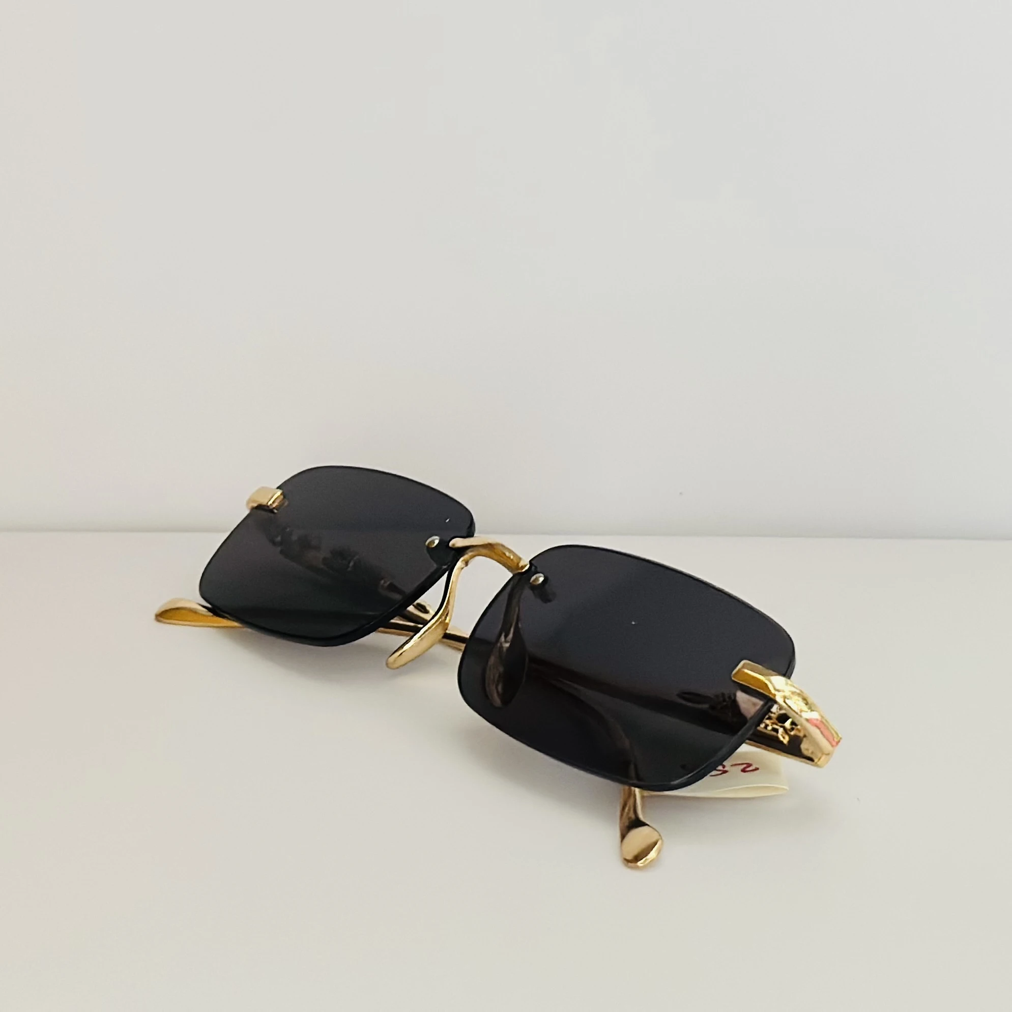 Gucci GG1221S 001 rimless rectangular sunglasses