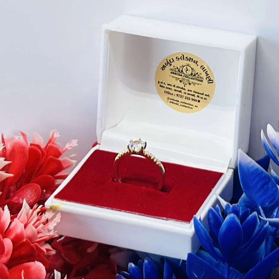 Gold and moissanite solitaire ring