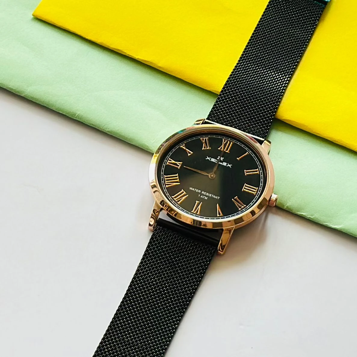 Black Snille Date Series analog watch with a white dial and black leather strap.