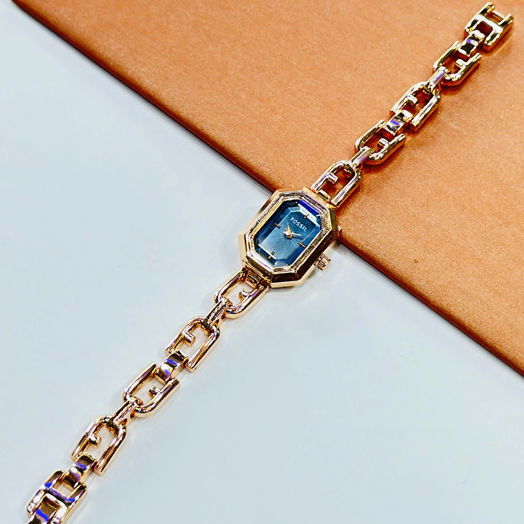 Fossil Harlow chain bracelet watch with a blue dial.
