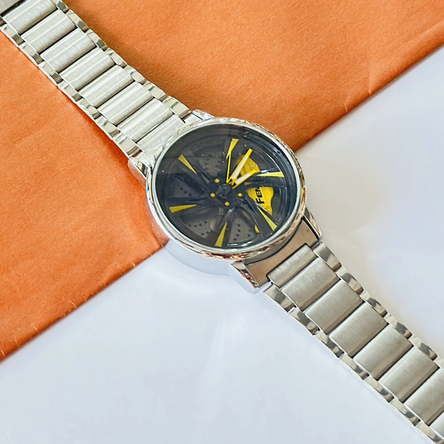 spinning car wheel rim-themed watch