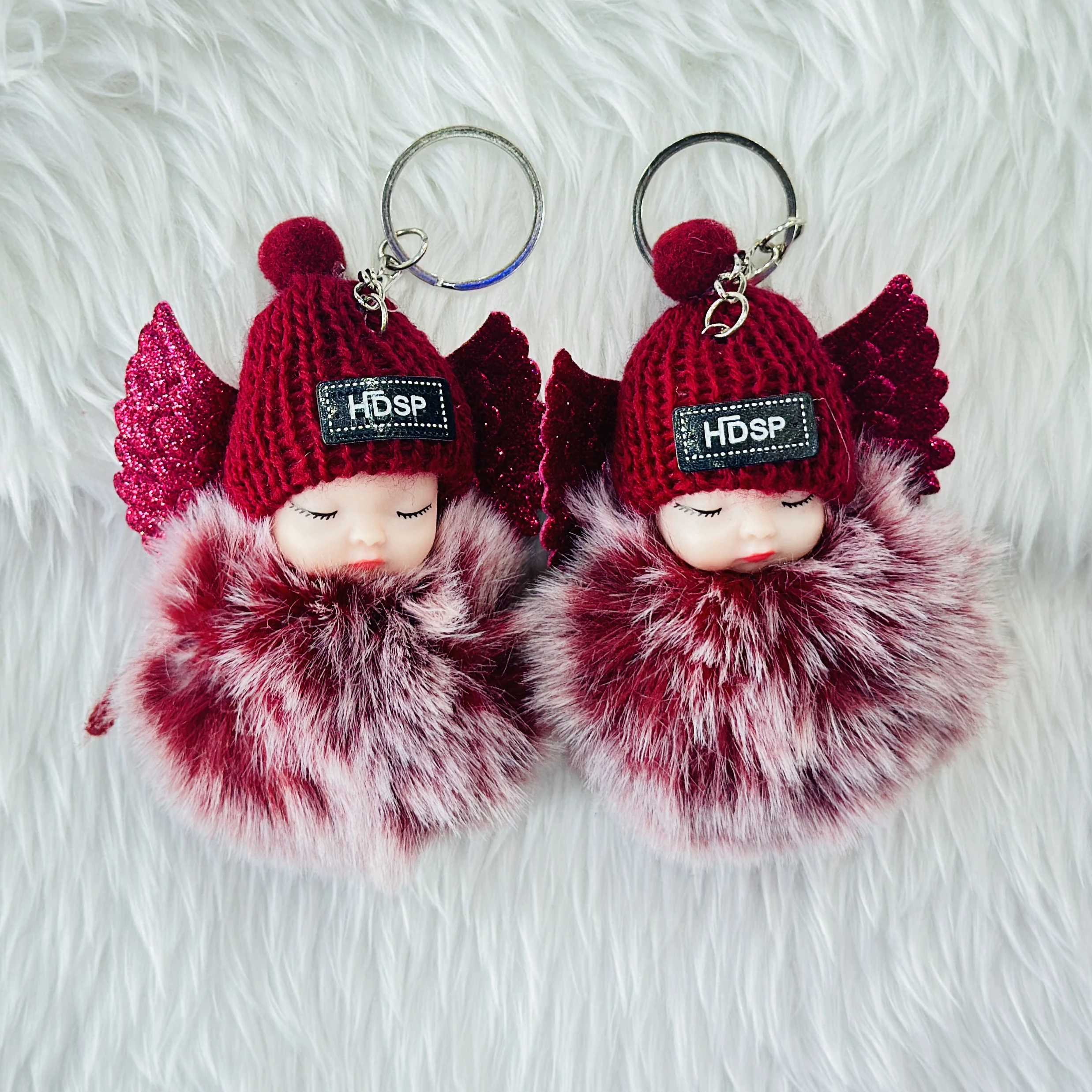 sleeping baby doll keychain