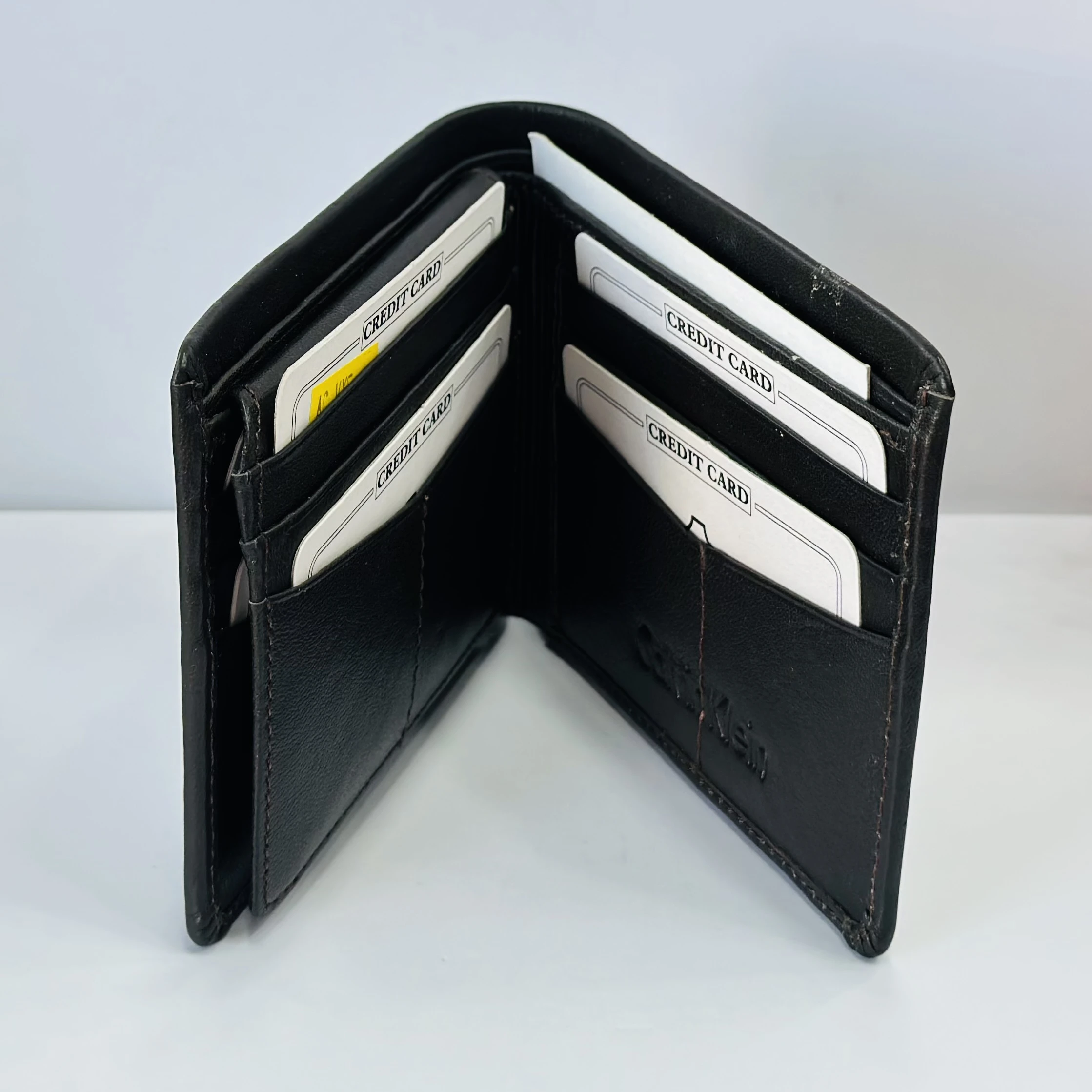 Calvin Klein men's bi-fold leather wallet in brown.