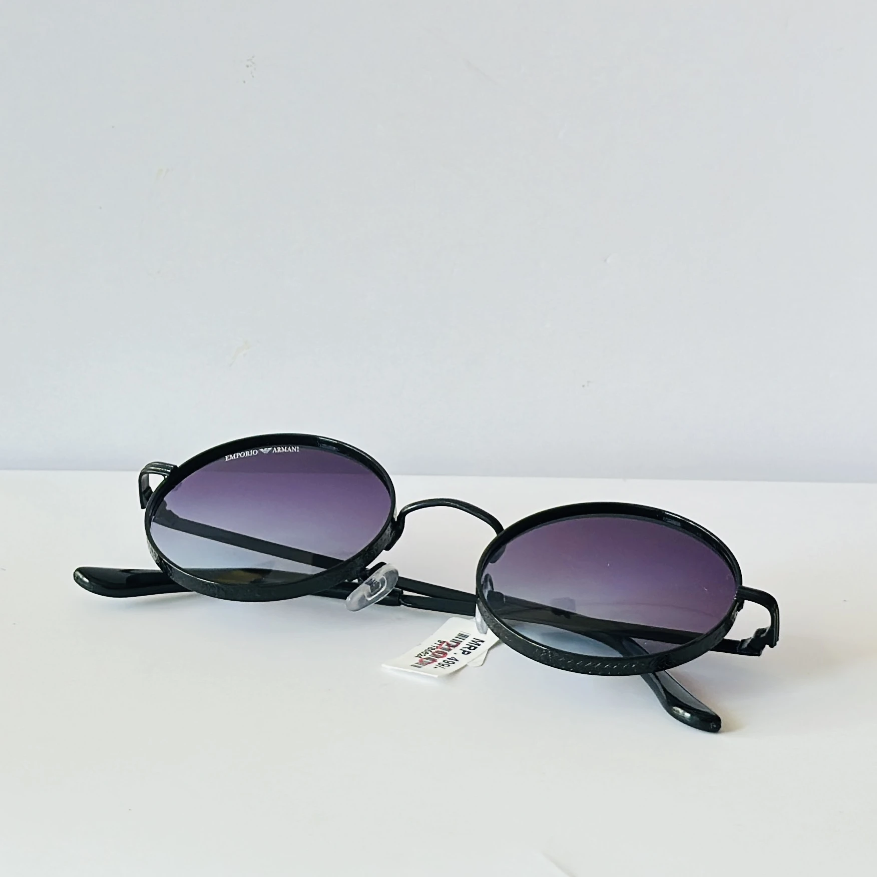 pair of round purple-tinted sunglasses