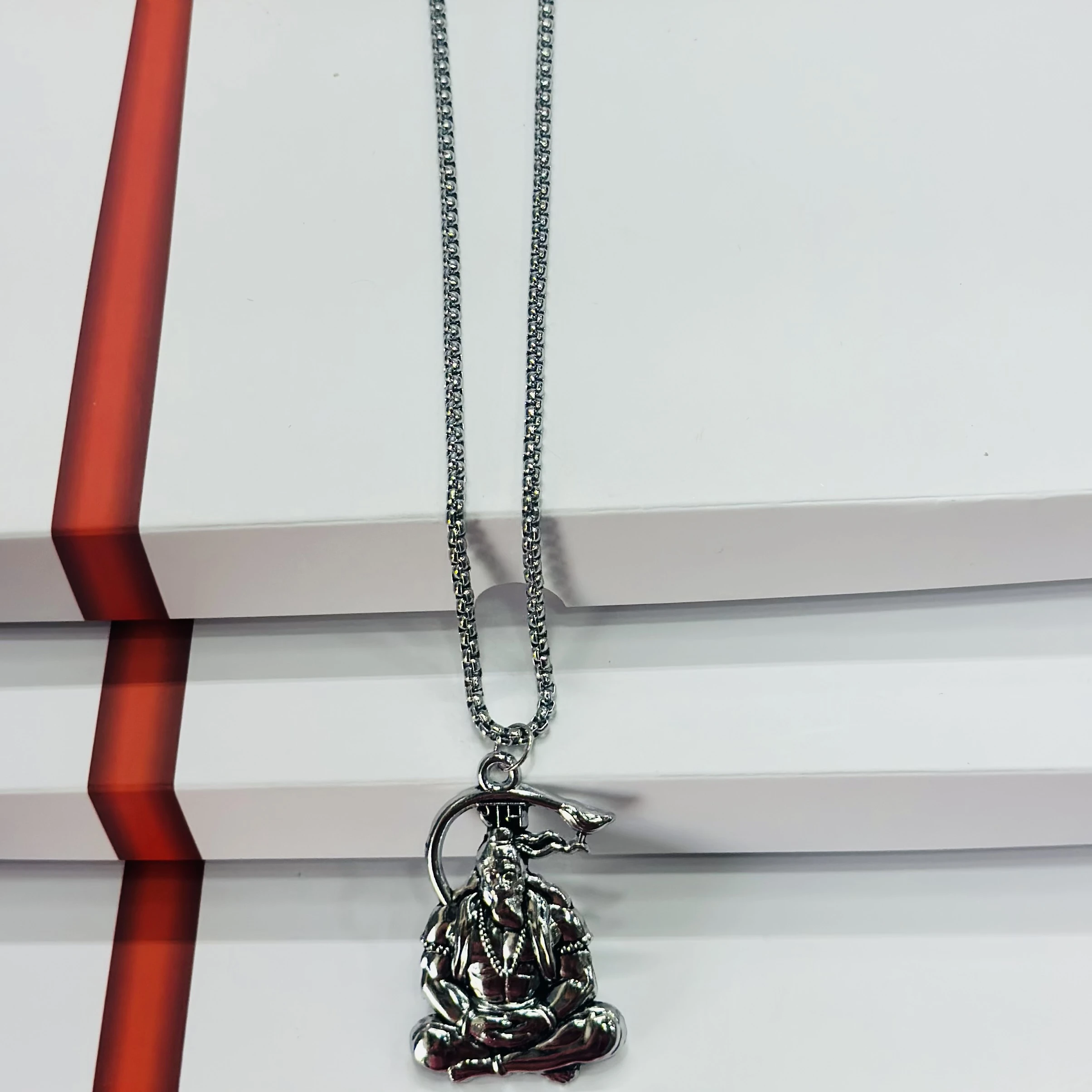 Silver finished Lord Hanuman pendant with a chain.