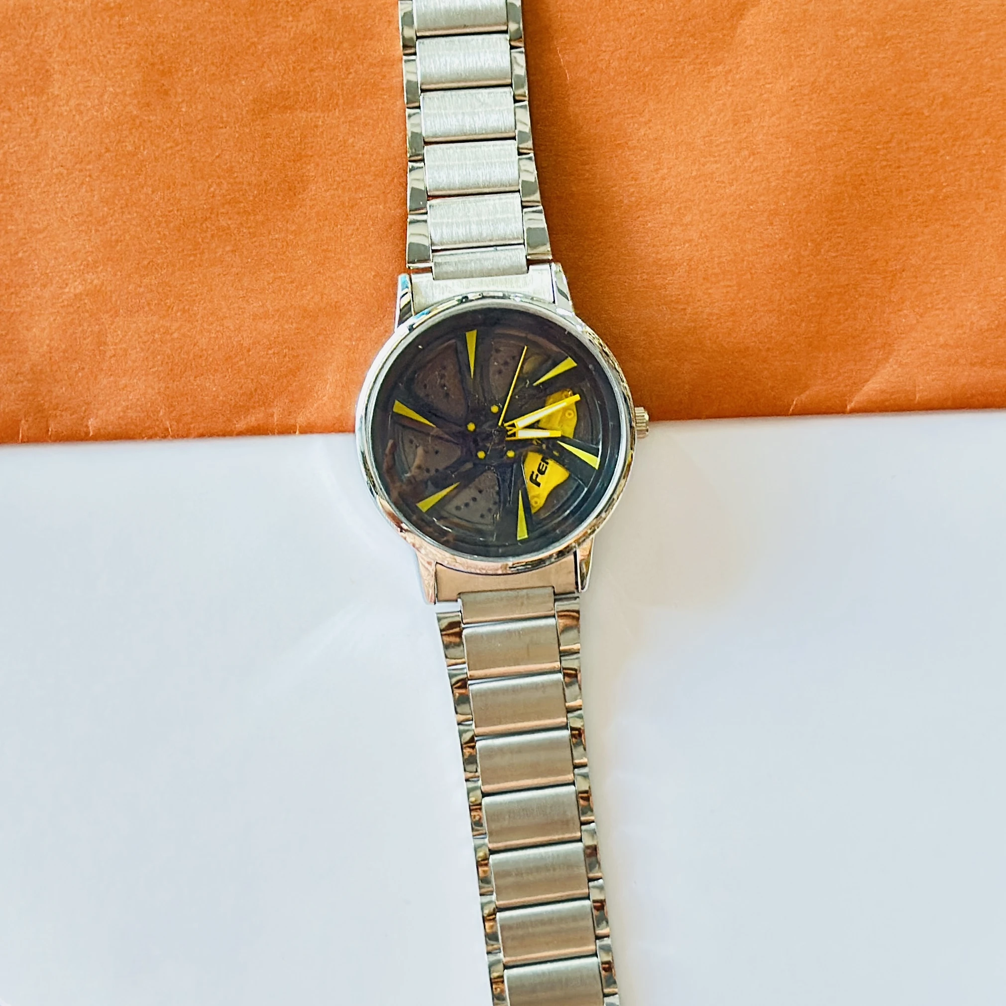 spinning car wheel rim-themed watch