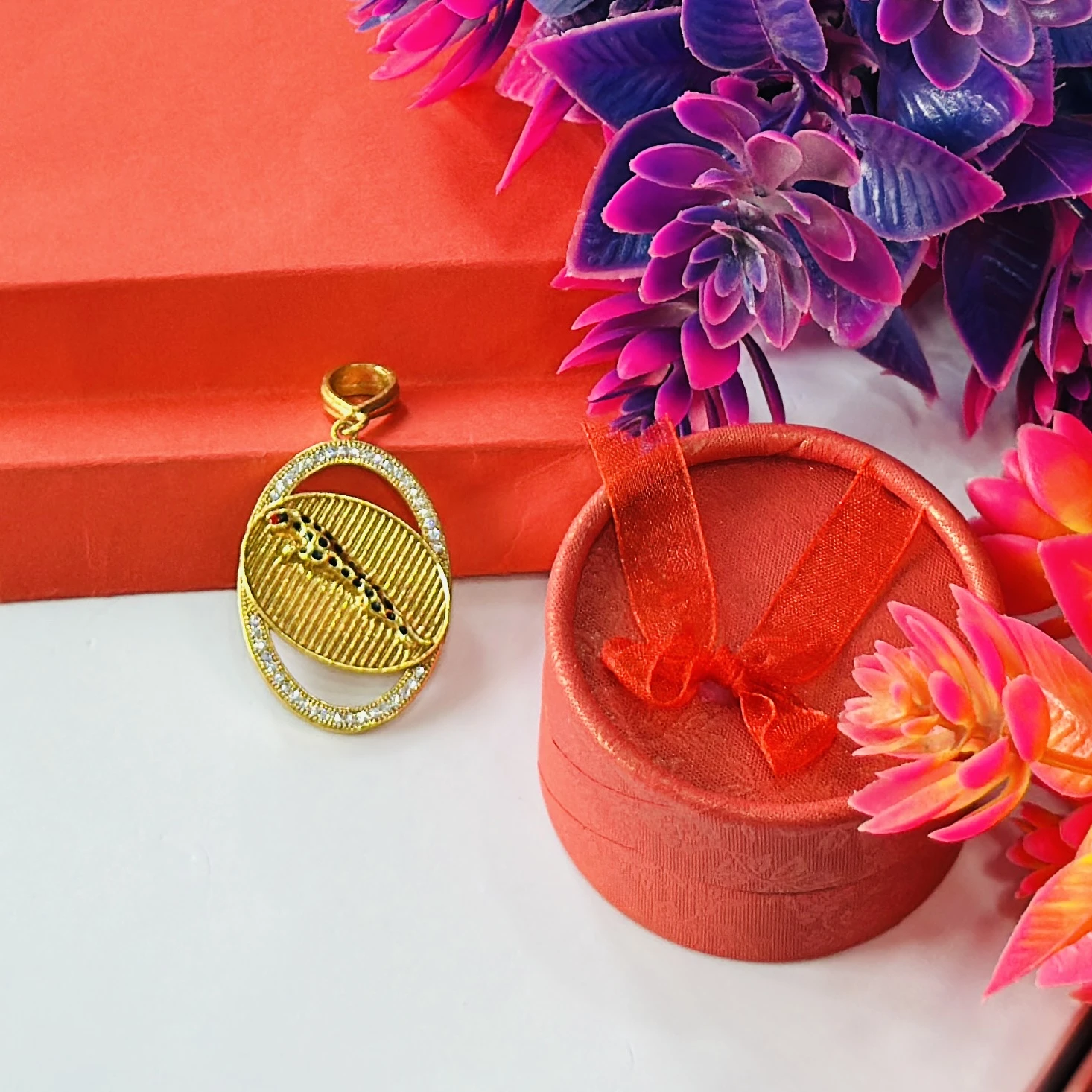 Gold plated pendant featuring a jaguar design.