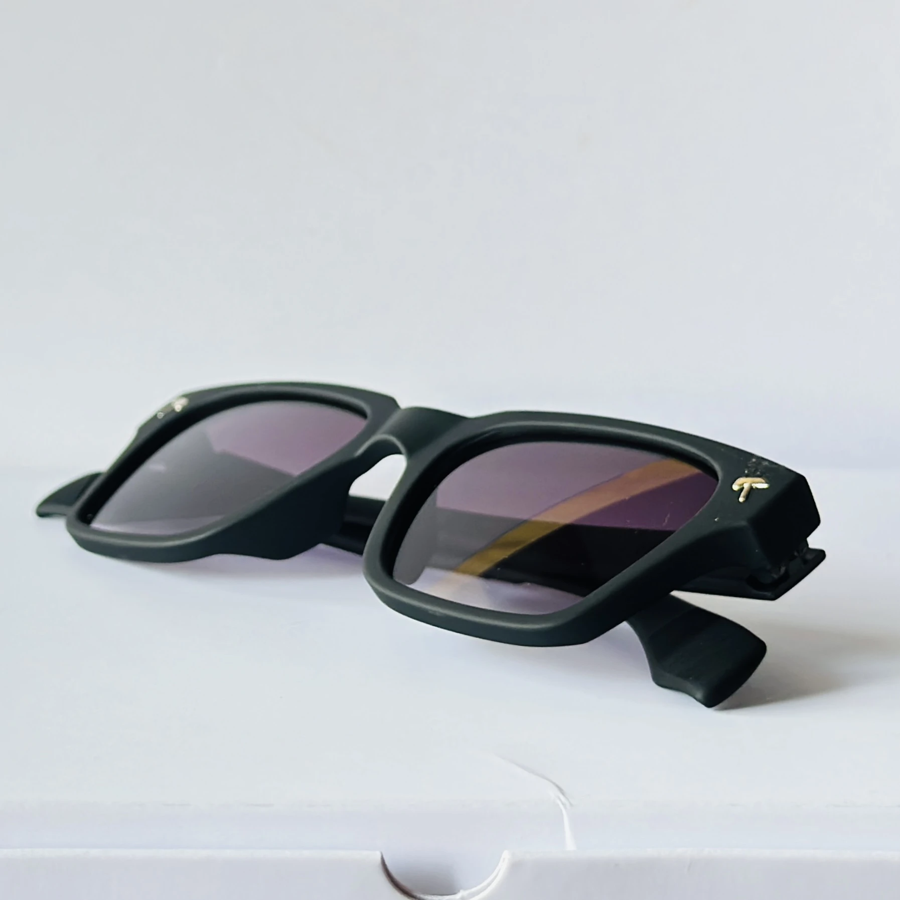 Black sunglasses appear to be the Tommy Hilfiger ML6012 model featuring gradient lenses