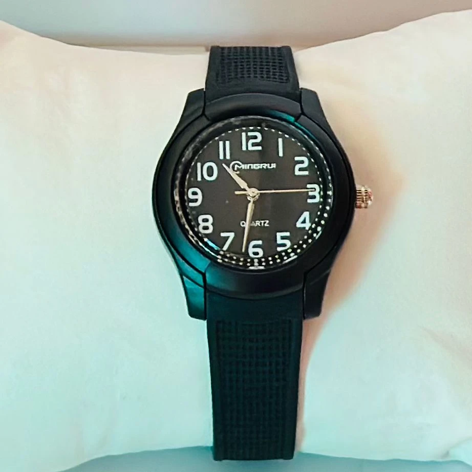 Edillas Kids Analog Watch with a mint green silicone strap.