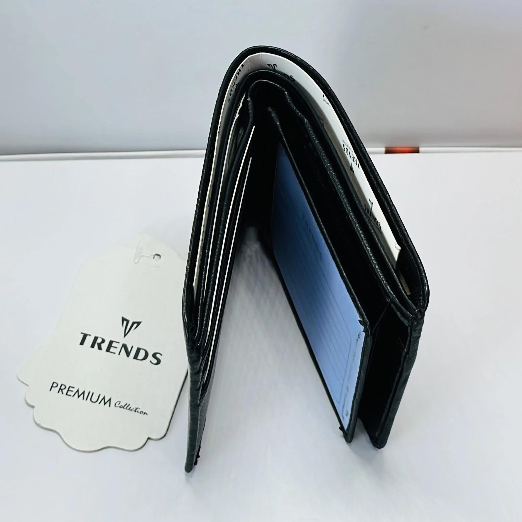 TRENDS black formal bi-fold wallet for men.