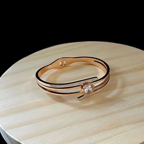 elegant gold-plated crystal-studded cuff bracelet