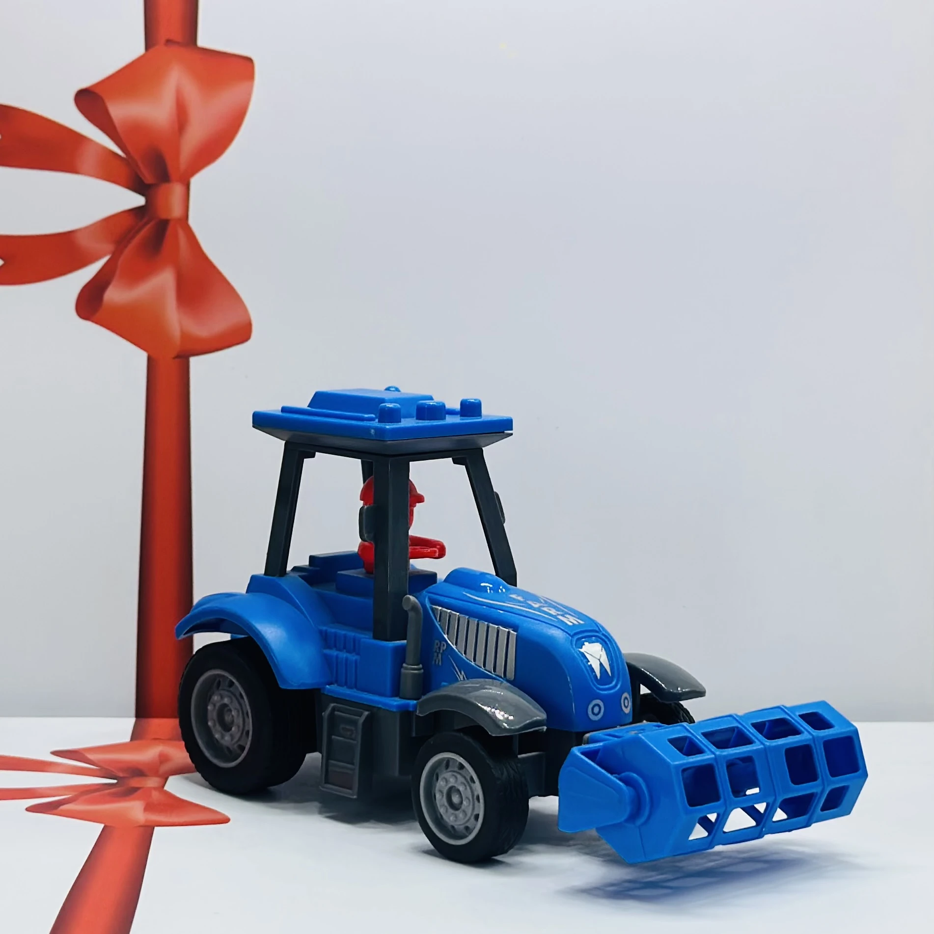Blue plastic toy tractor