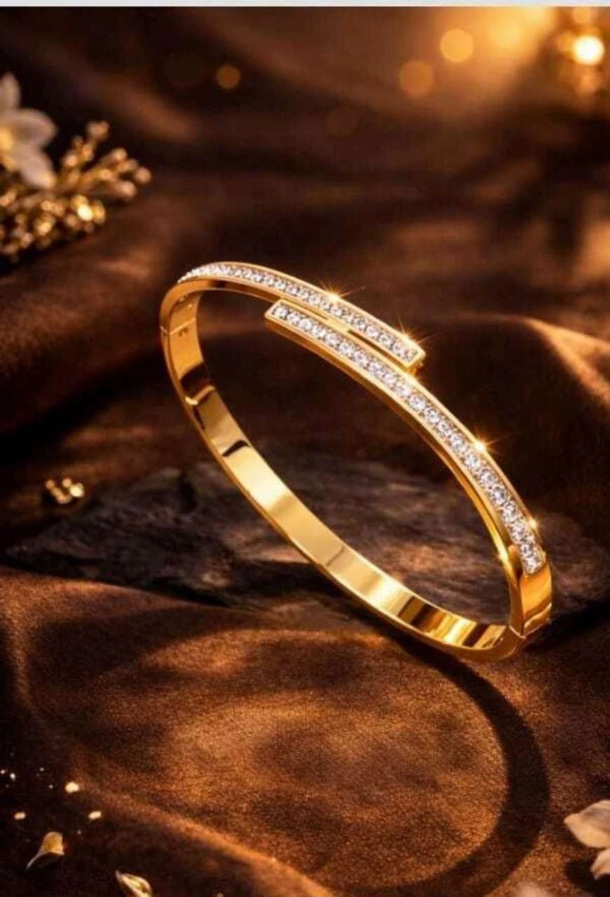 elegant gold-plated crystal-studded cuff bracelet