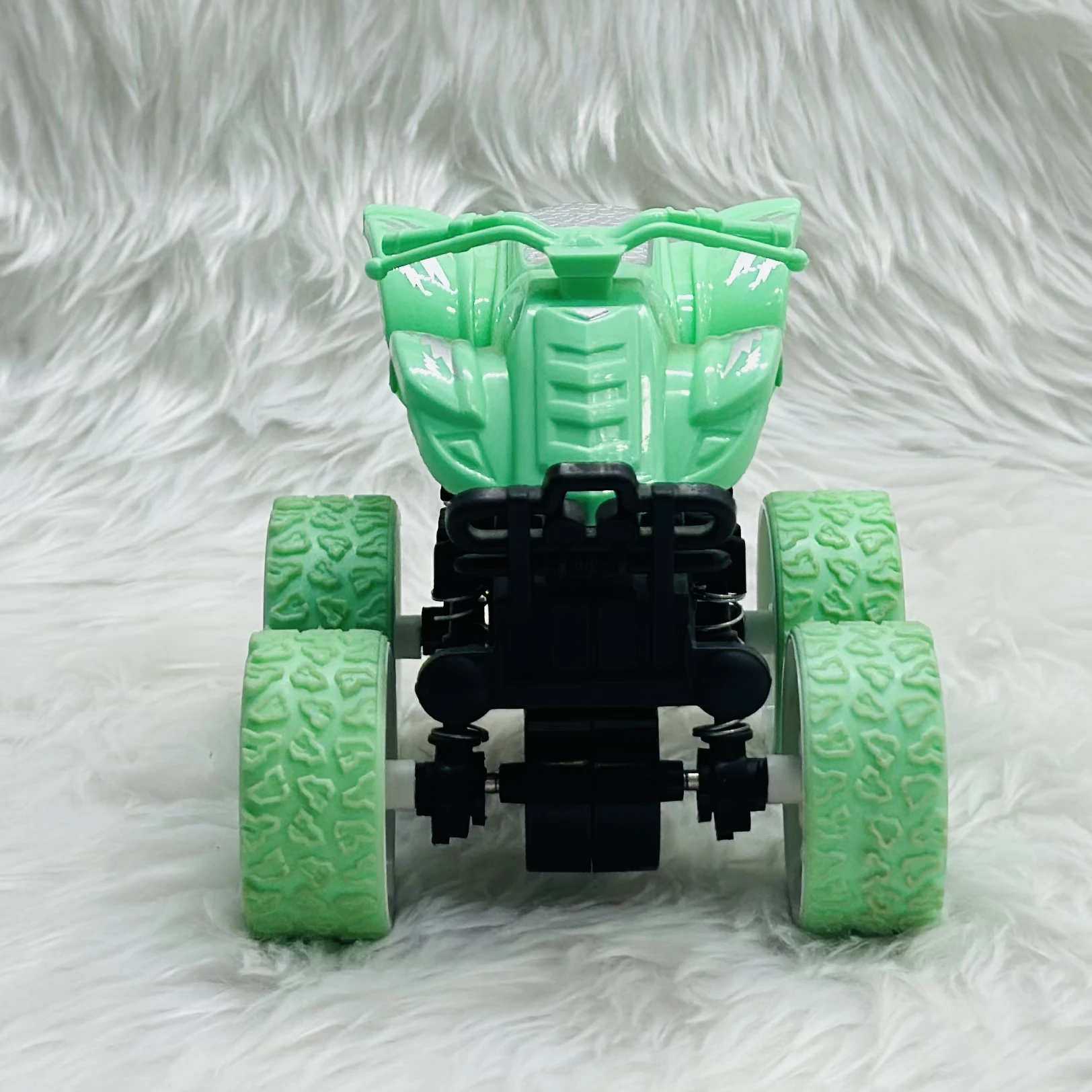 mini monster truck toy, which is typically a friction-powered stunt car.