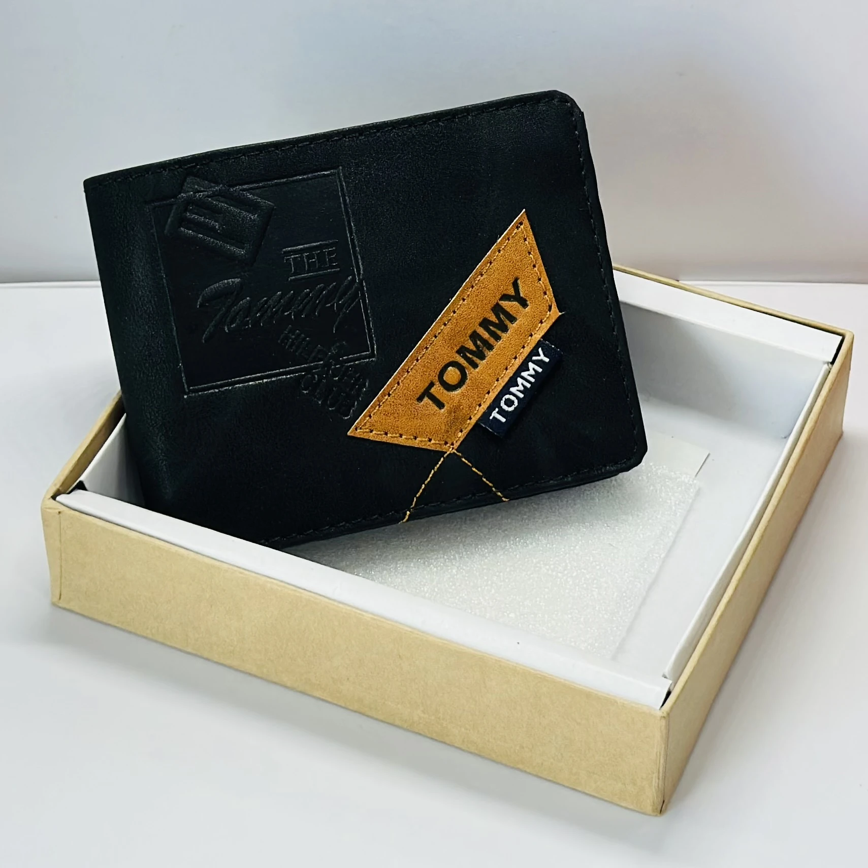 Tommy Hilfiger men's black leather bi-fold wallet.