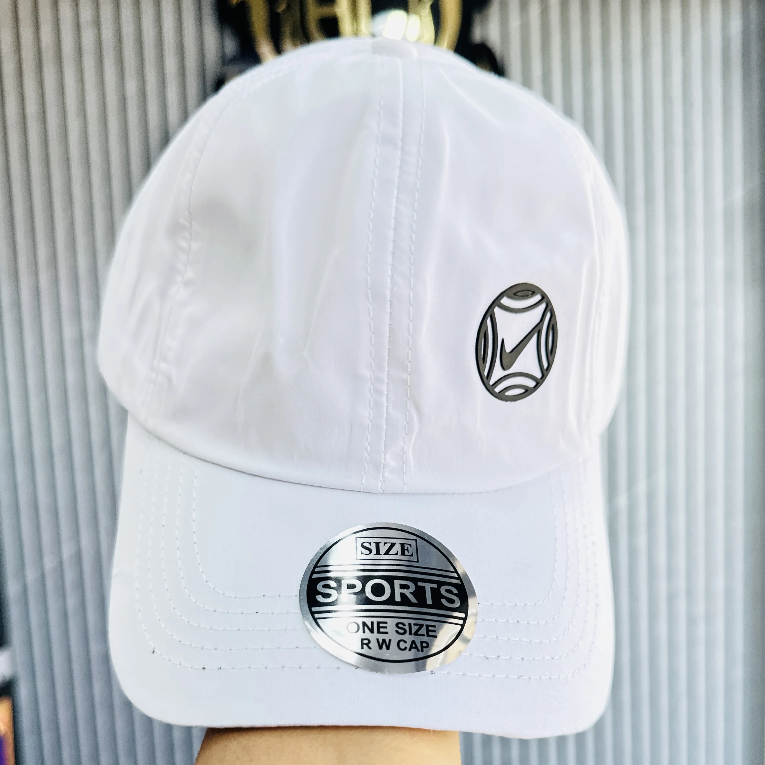 appears to be a white Nike branded baseball cap