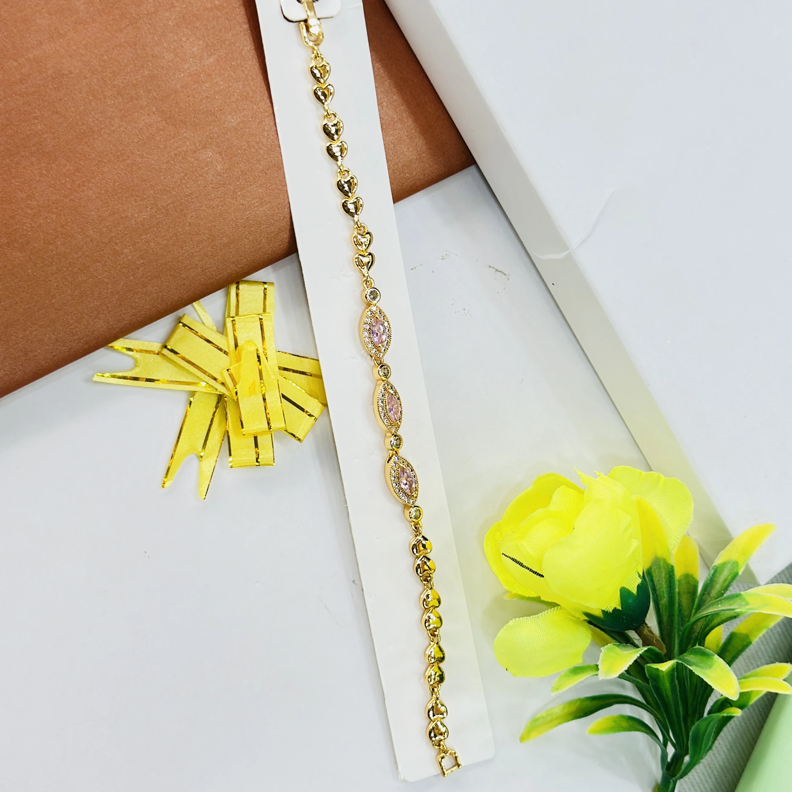 gold-plated bracelet featuring small heart-shaped links