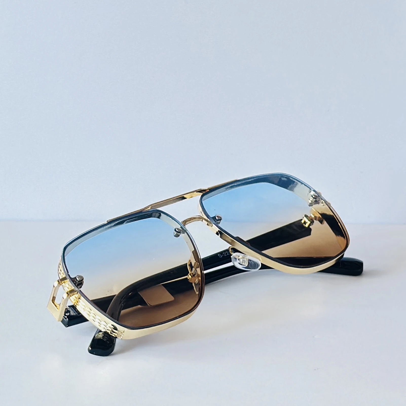 sunglasses appear to be the Maybach