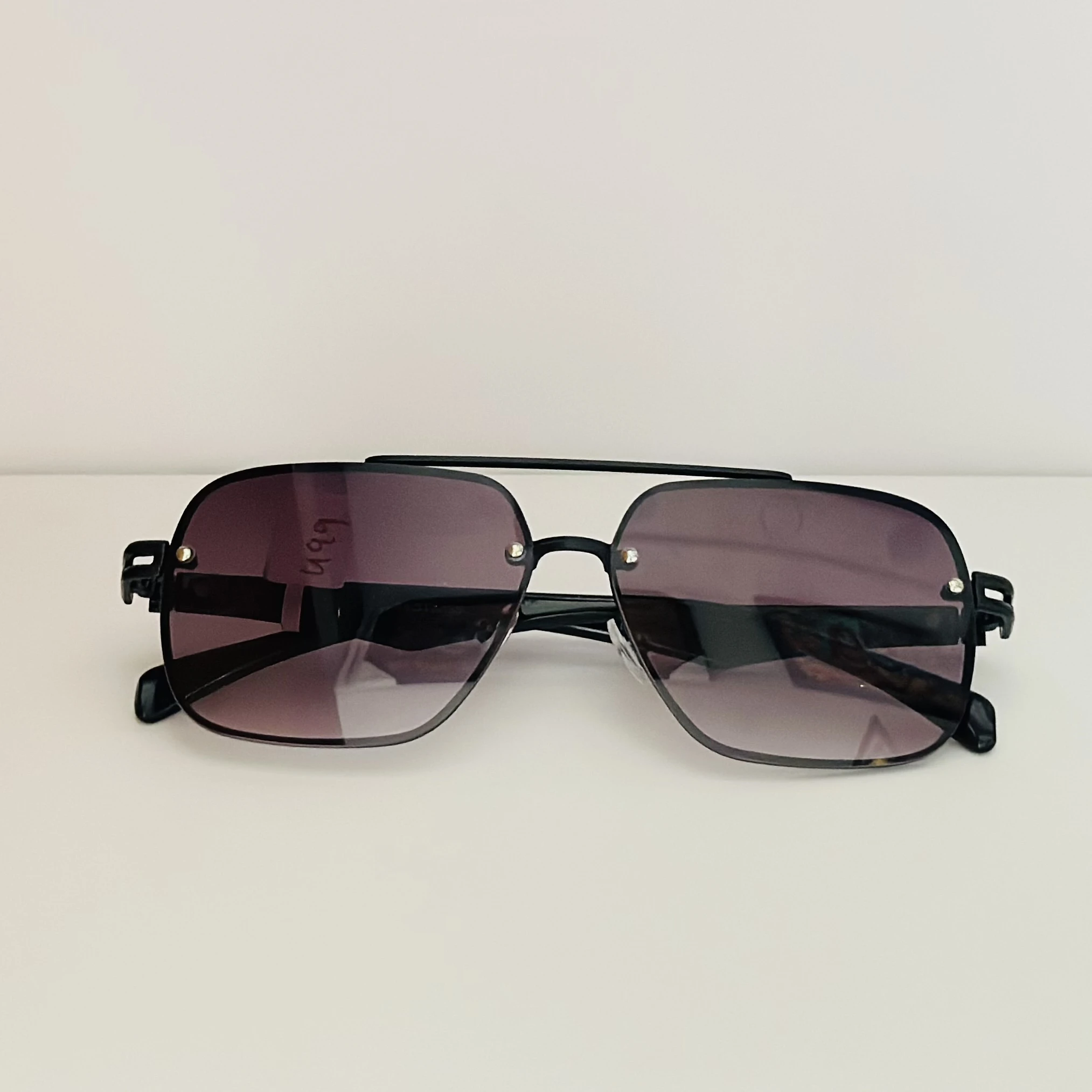 gradient square sunglasses with a black frame.