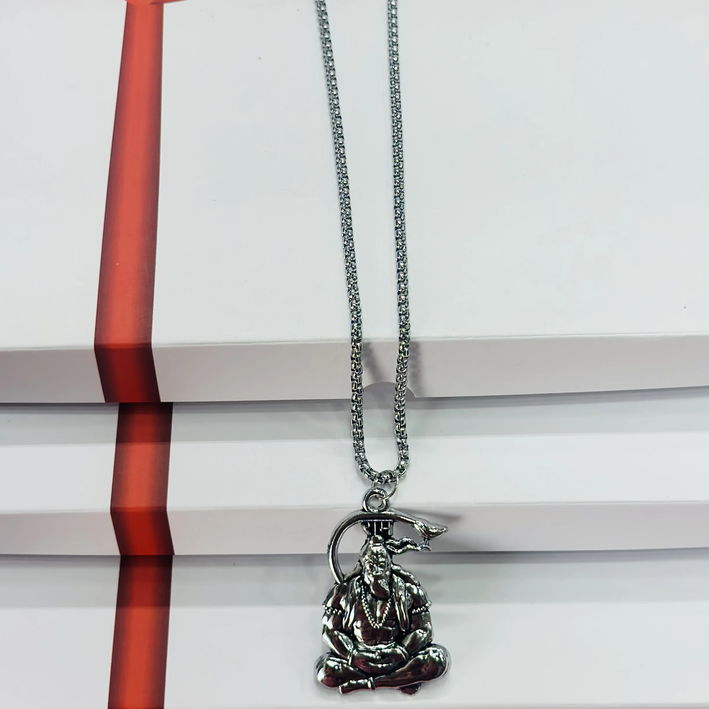 Silver finished Lord Hanuman pendant with a chain.