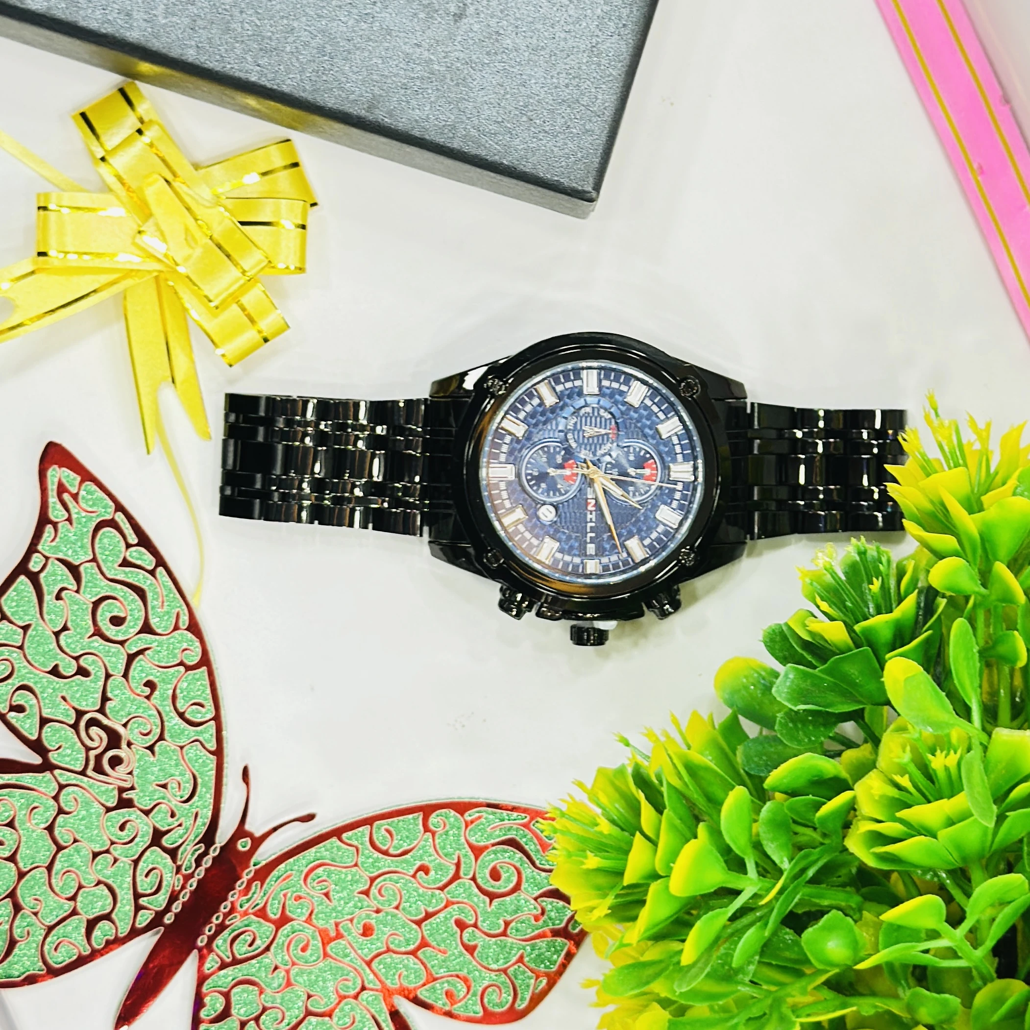 Black metal analog chronograph wristwatch