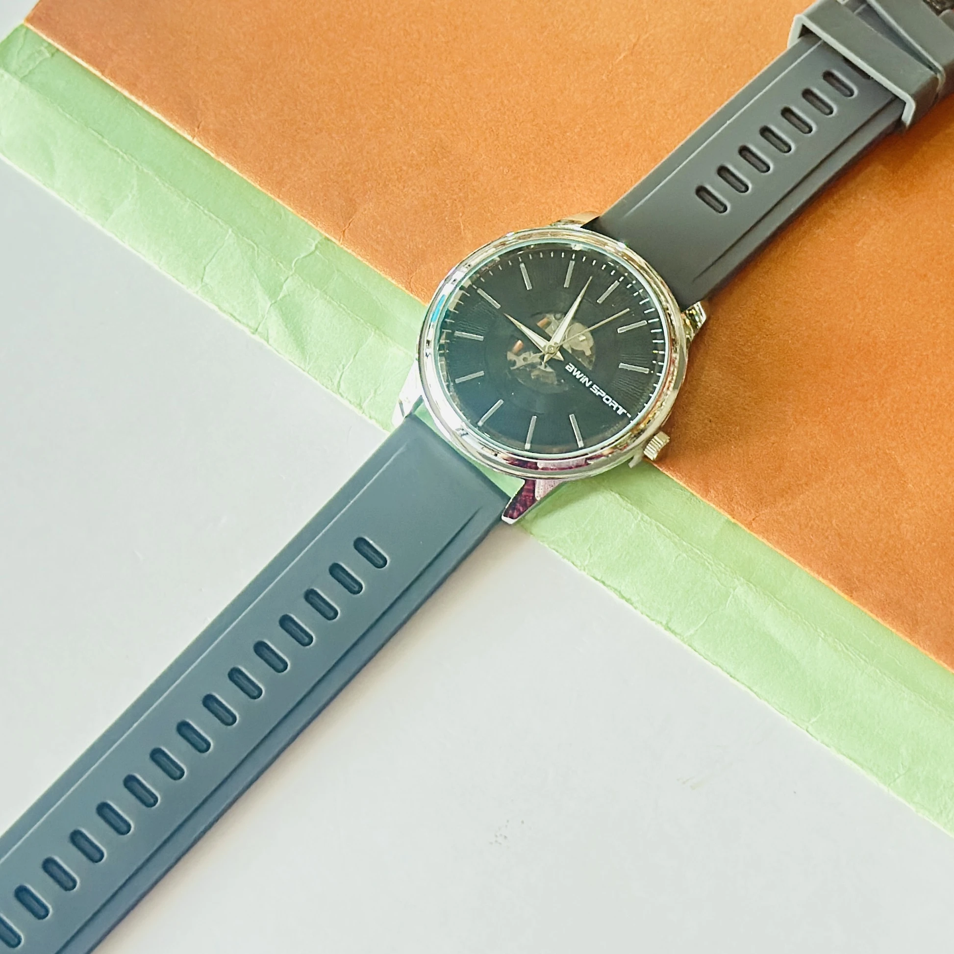 AWIN SPORT analog watch with a black dial and a grey silicone strap.