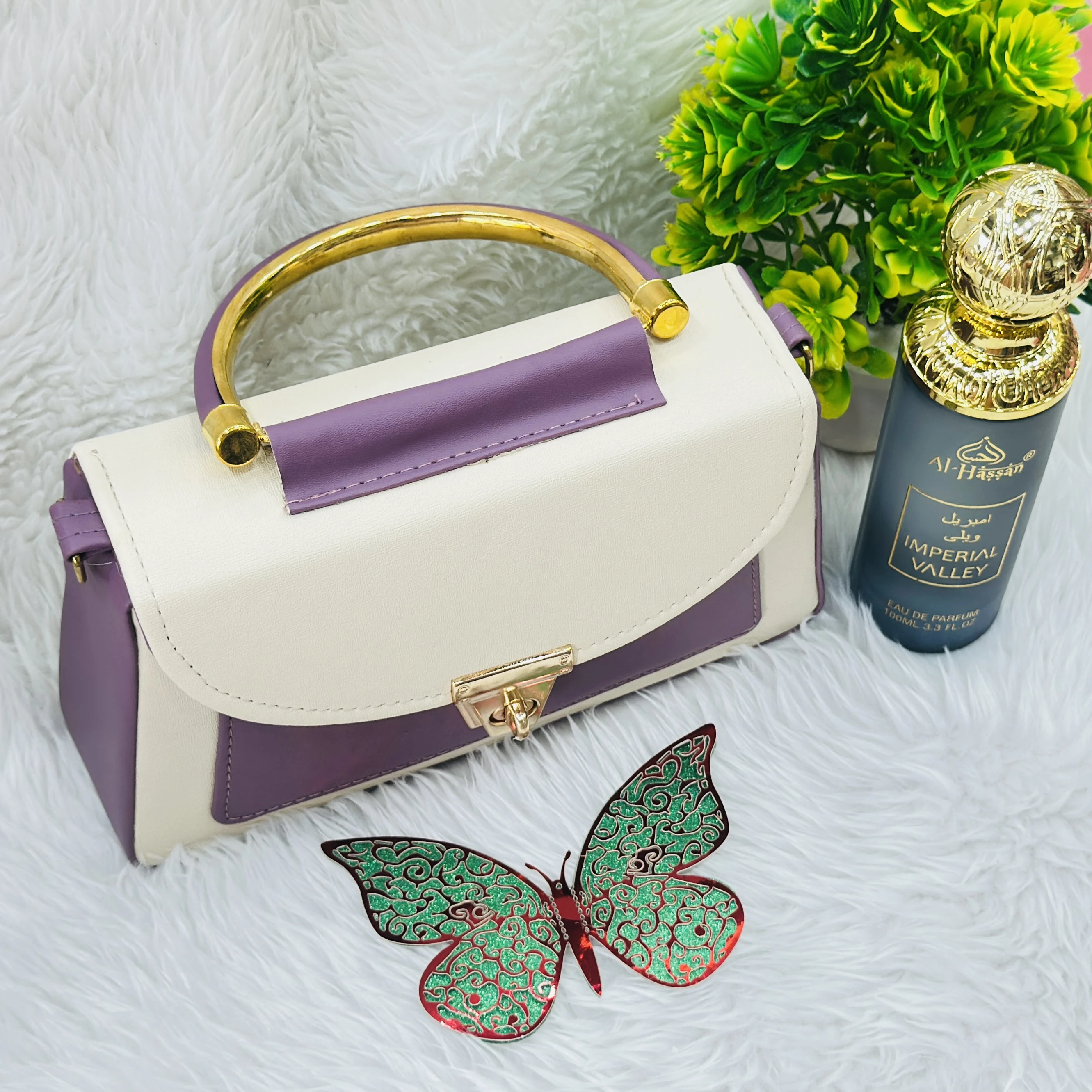 purple and cream top-handle handbag