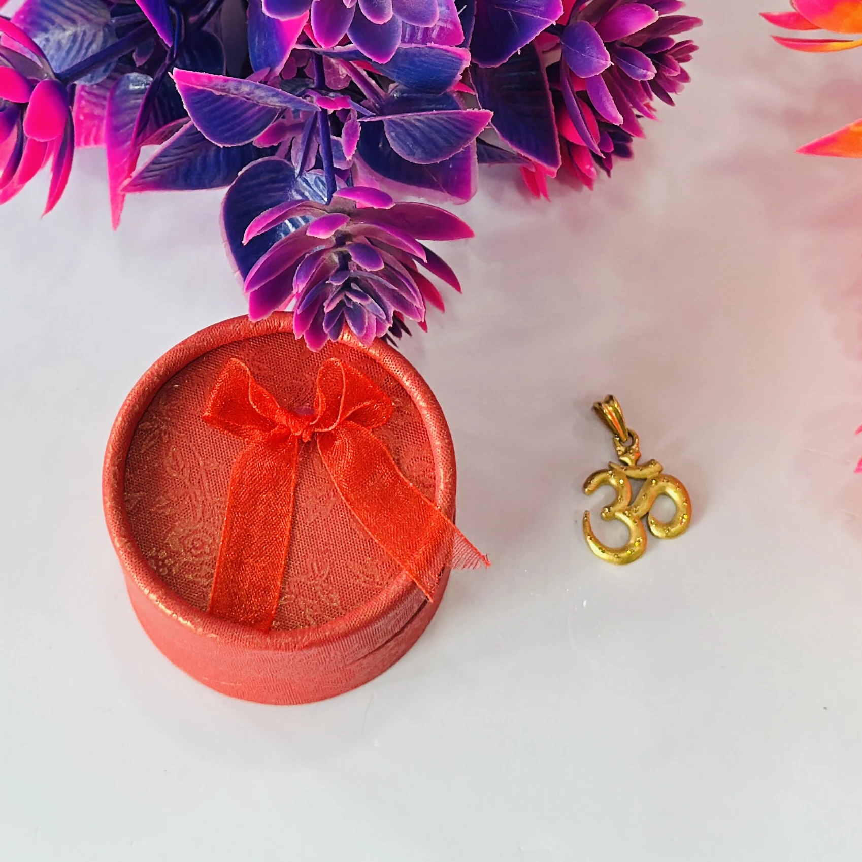 Gold plated Om pendant.