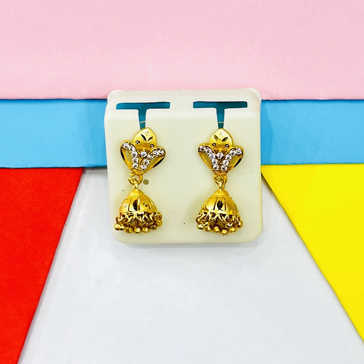 pair of ornate gold jhumka earrings