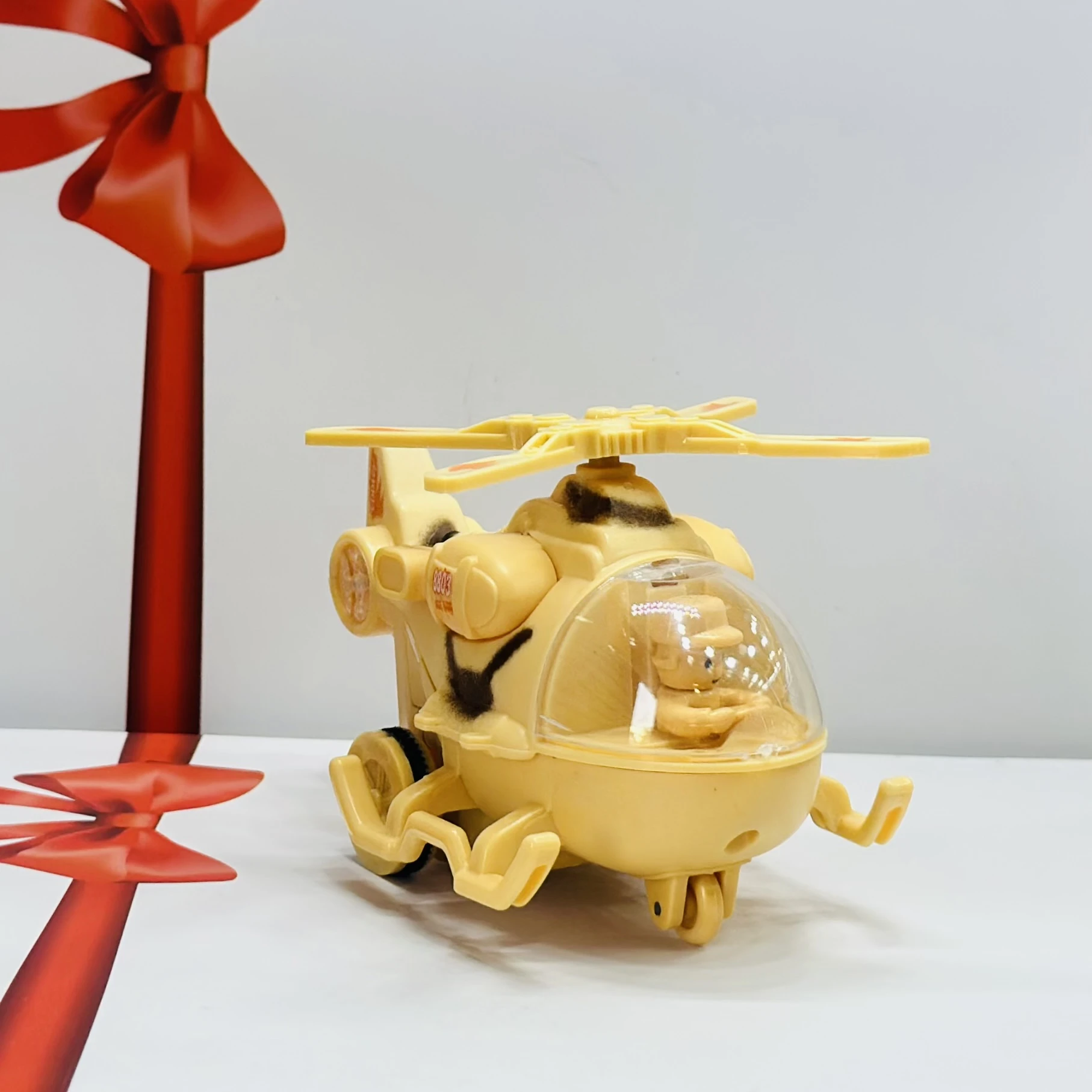 friction-powered toy helicopter