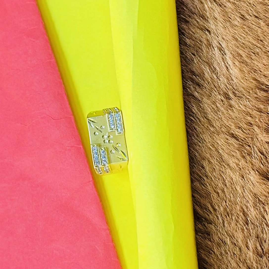 Gold plated men's ring made of brass with cubic zirconia stones.