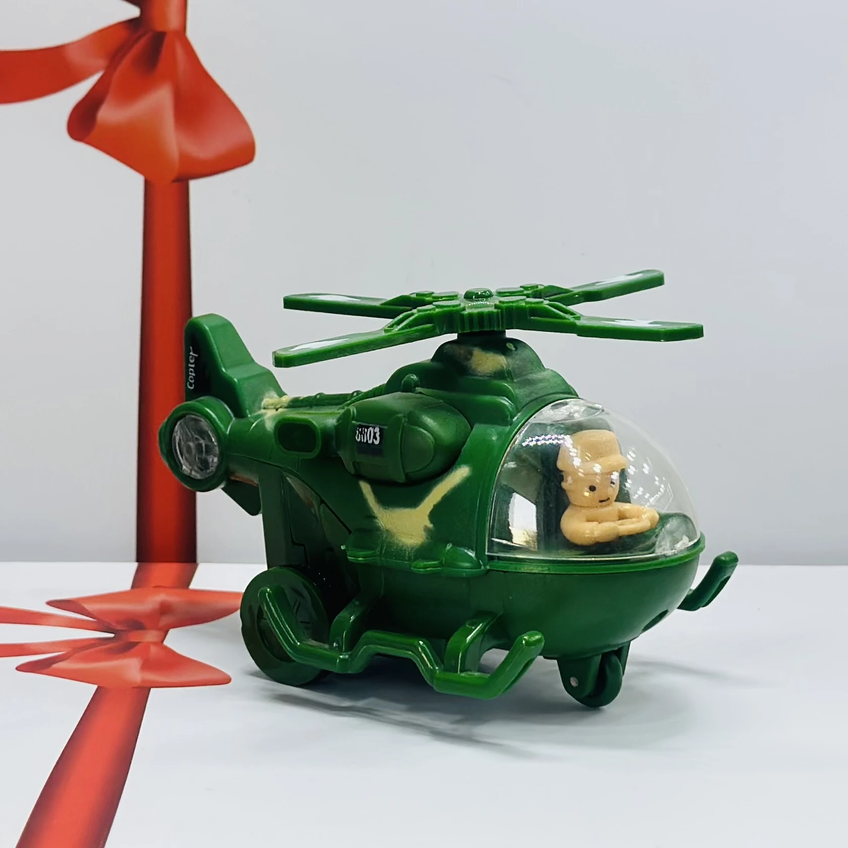 friction-powered toy helicopter