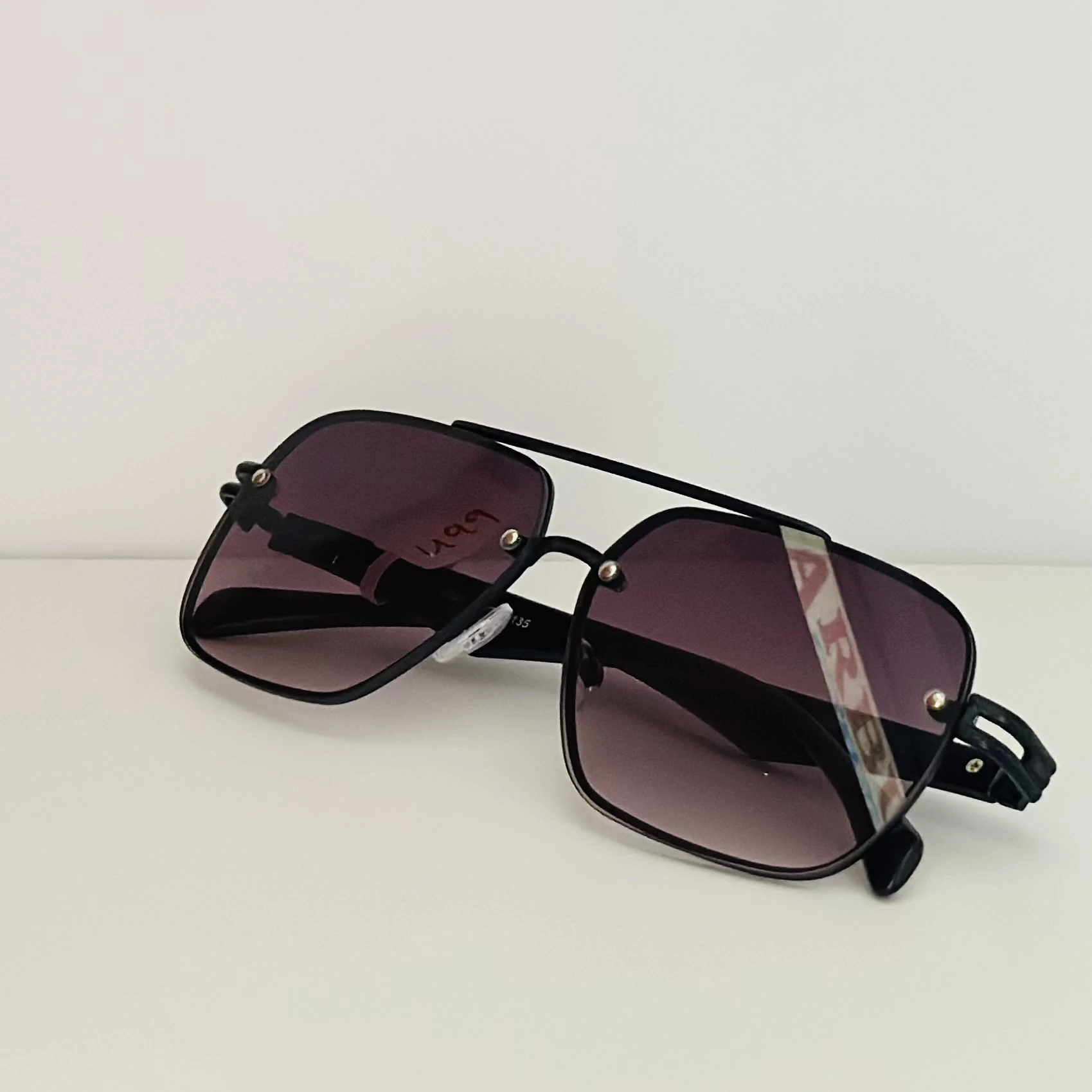 gradient square sunglasses with a black frame.