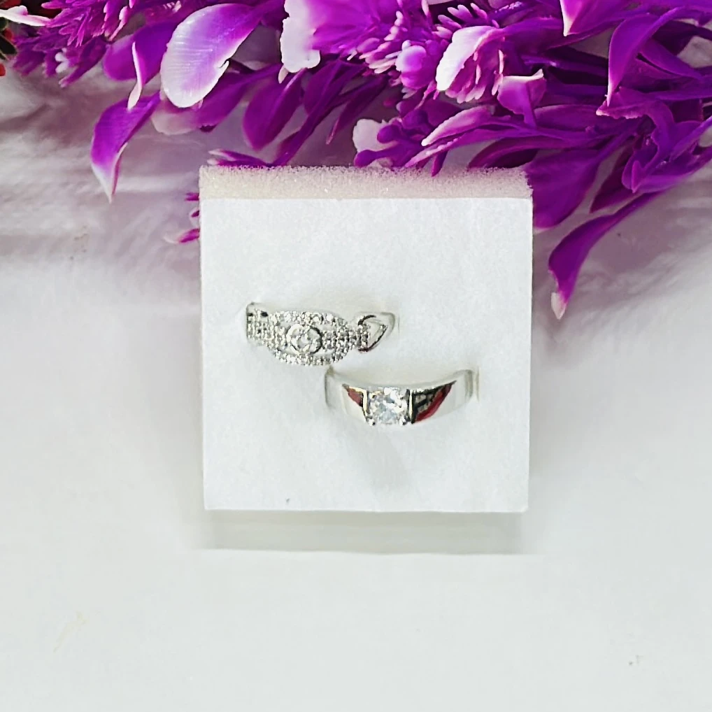 Set of silver-toned couple rings