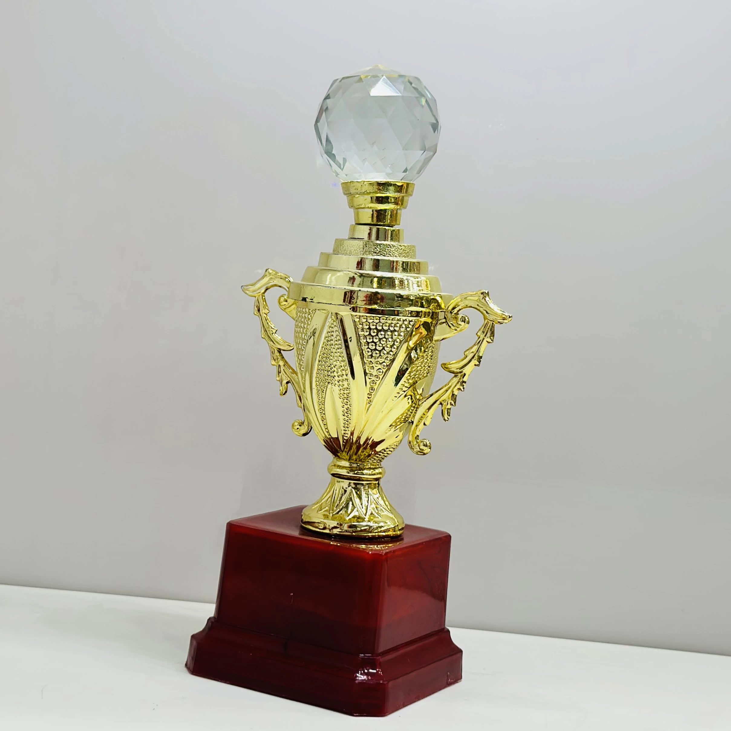 cricket trophy featuring a batsman figure.