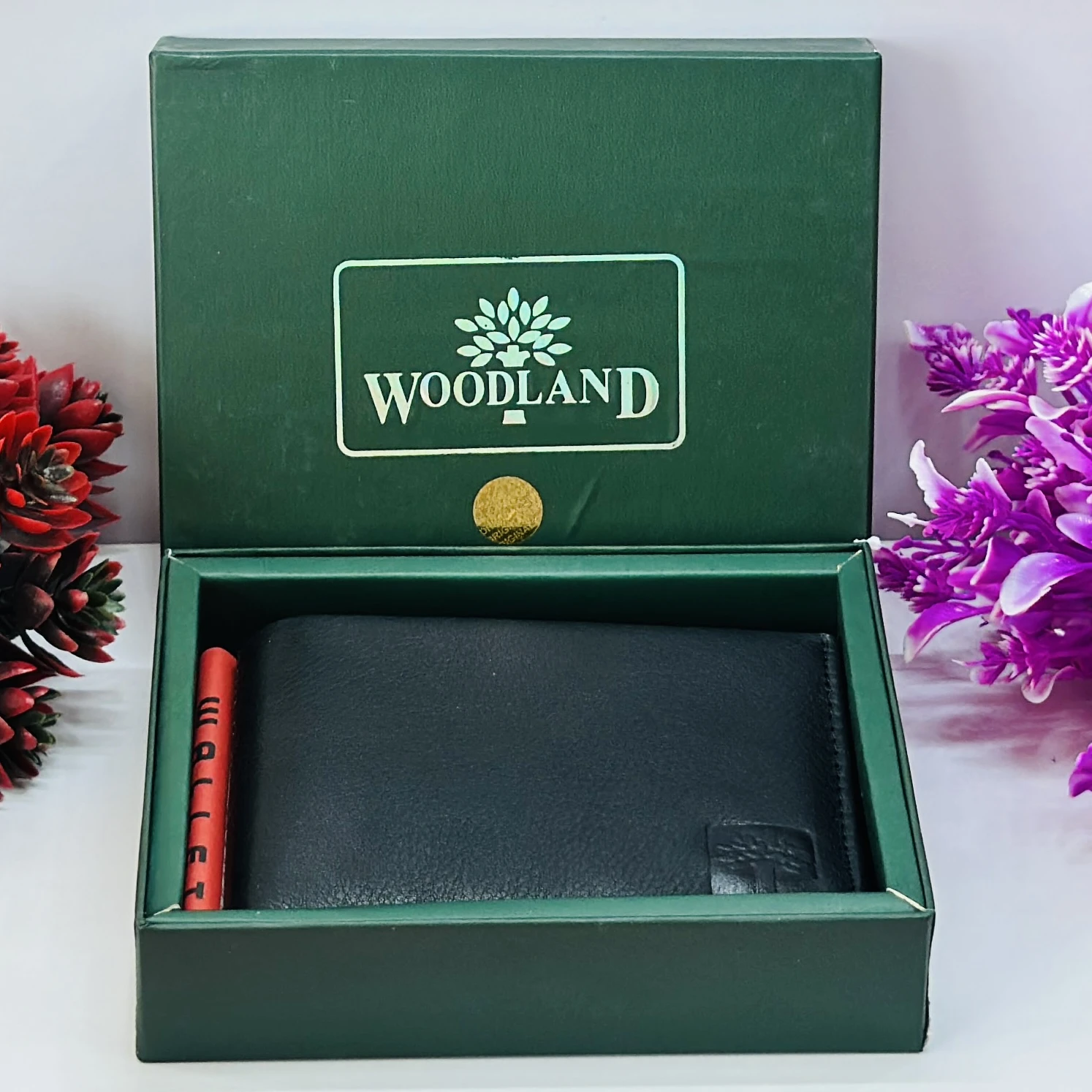 Woodland Men's black genuine leather bi-fold wallet.