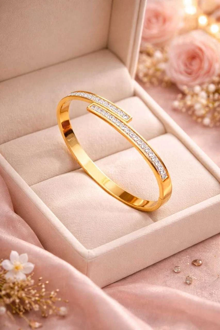 elegant gold-plated crystal-studded cuff bracelet