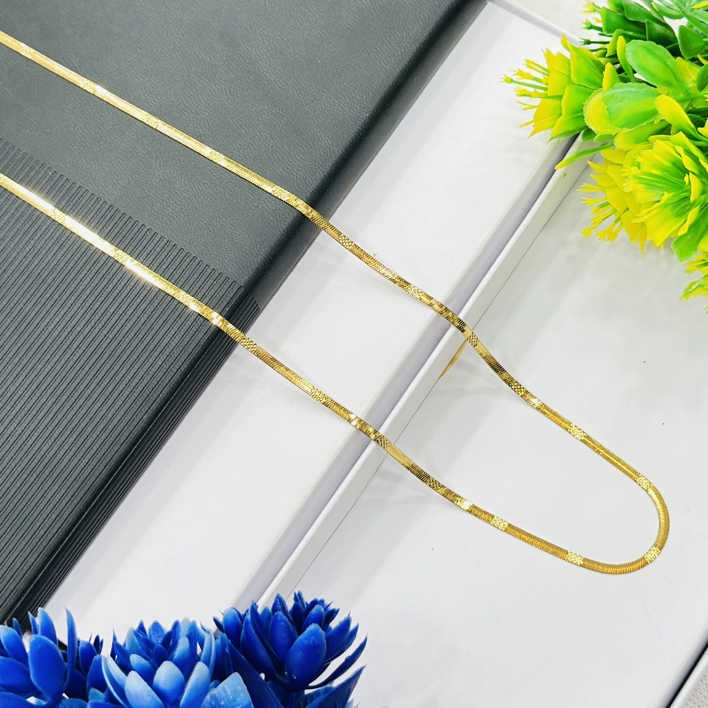 premium gold-plated herringbone snake chain.