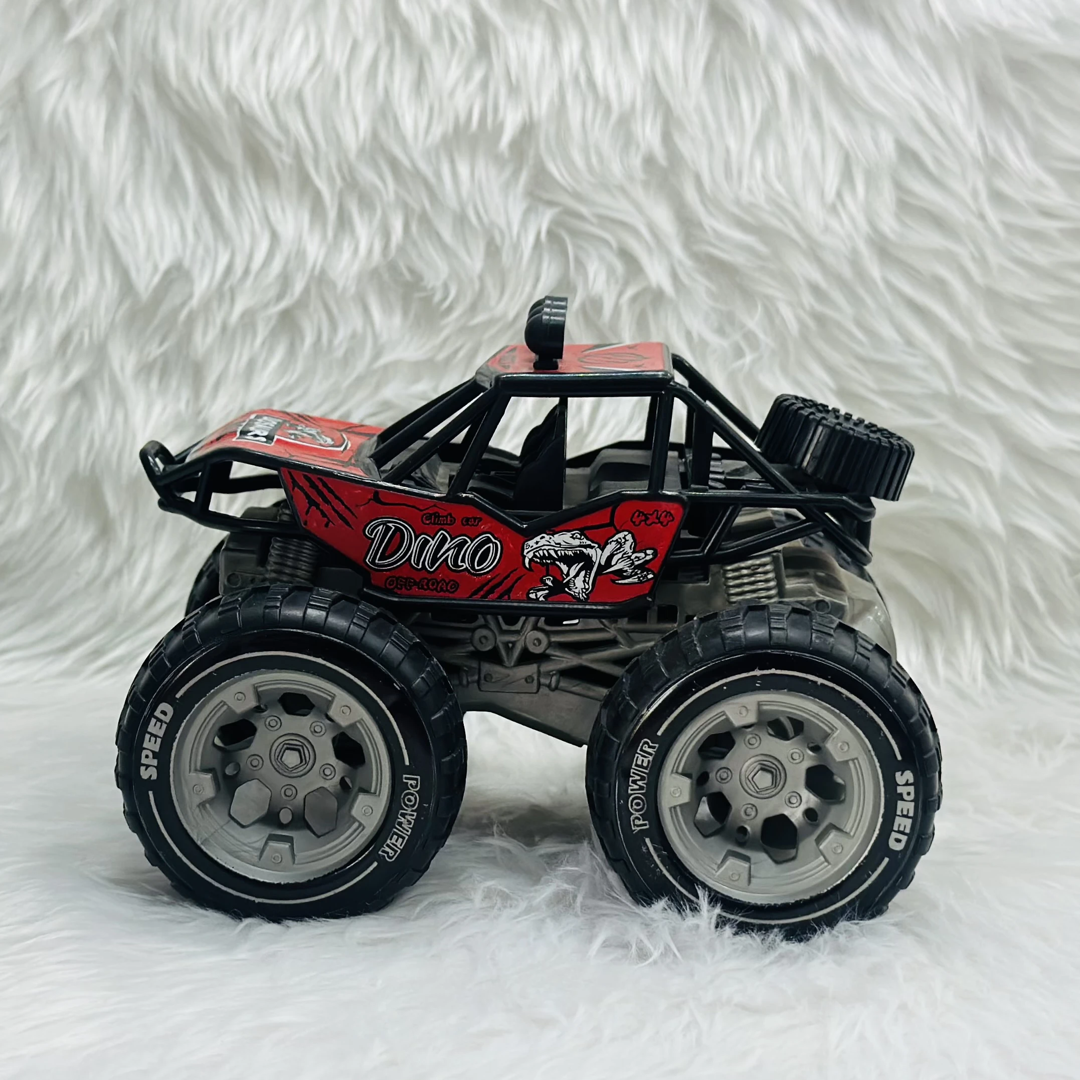 Red "Dino Off-Road" toy monster truck