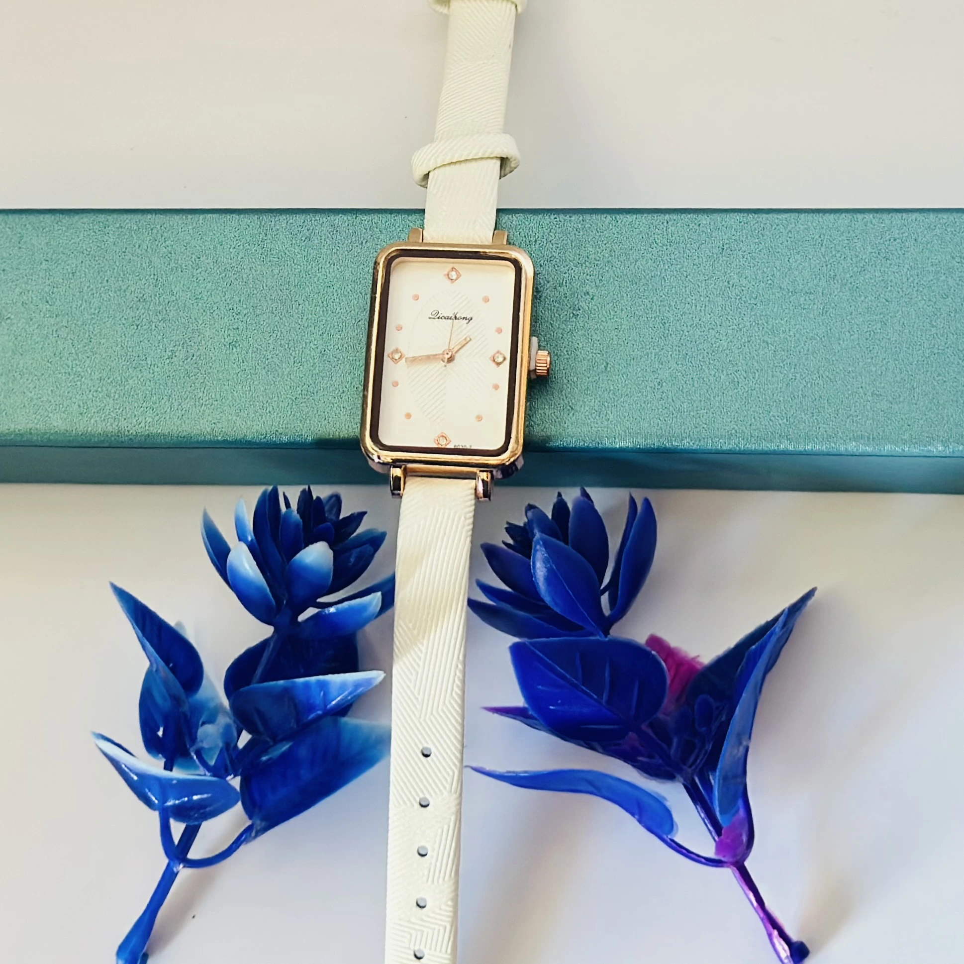 White Focus quartz analog watch for women with a white leather strap.