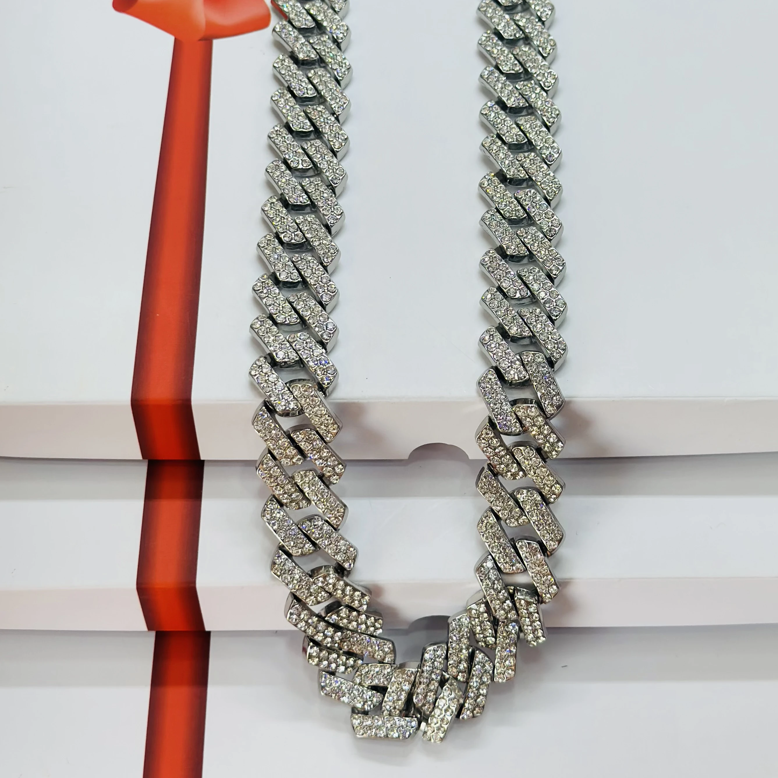 silver-plated stainless steel Cuban link chain with rhinestones.