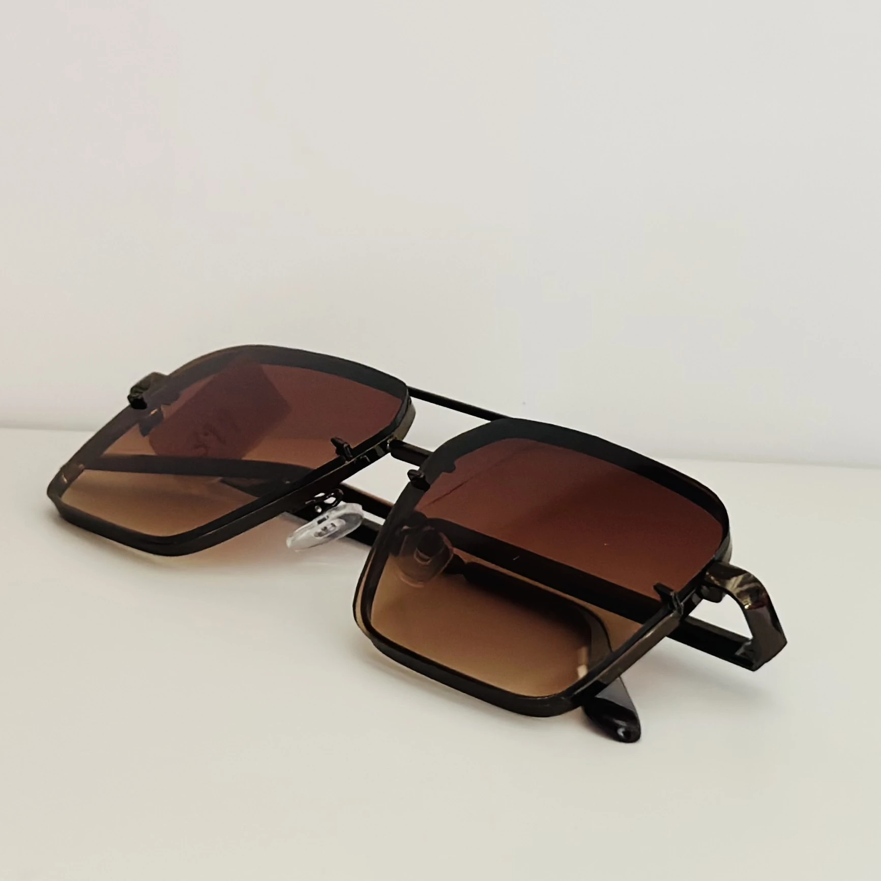 pair of square aviator gradient sunglasses with a brown metal frame.